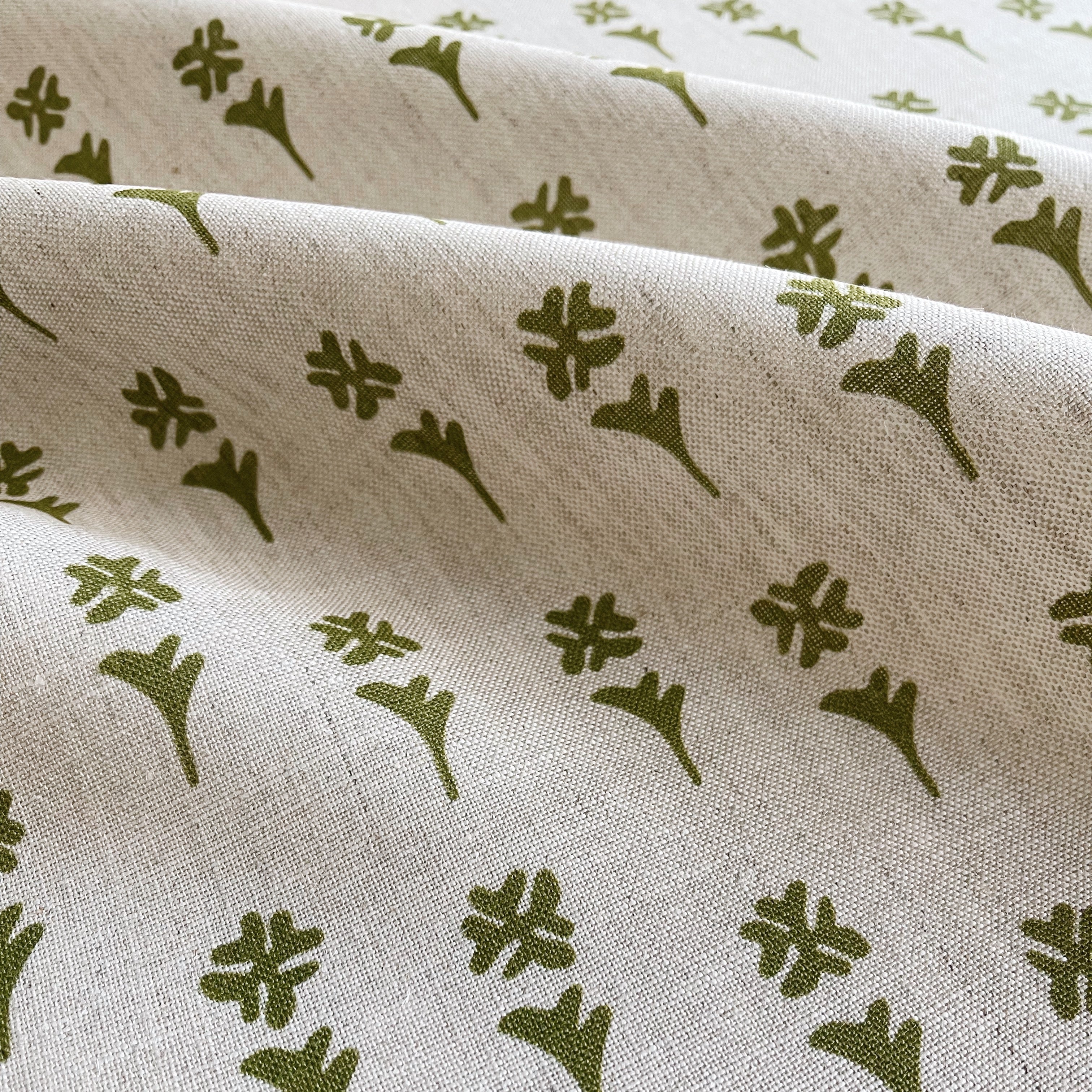 Daffodil fabric in Sprout β close-up of linen texture and leafy pattern; perfect for pattern sofas