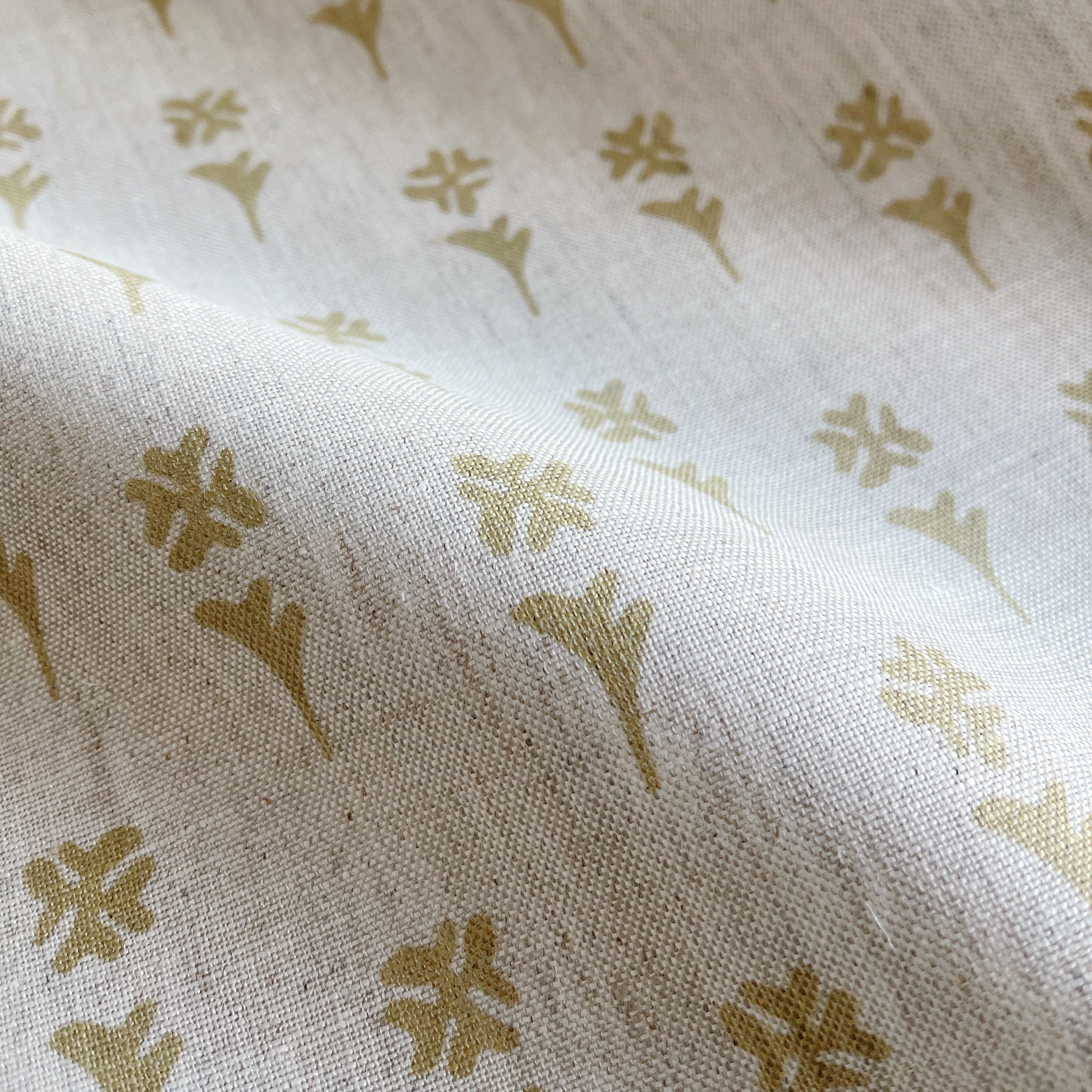 Daffodil fabric in Tupelo β close-up of linen texture and leafy pattern; perfect for pattern sofas