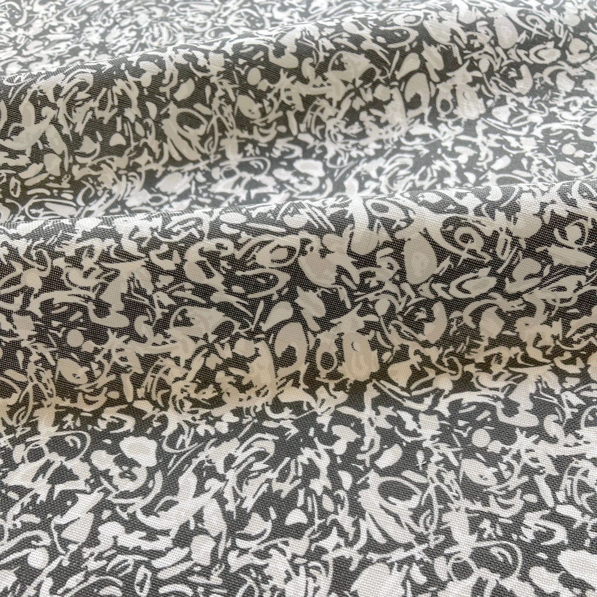 Estuary Granite pillow by Emily Daws styled in an interior — Waterways Collection