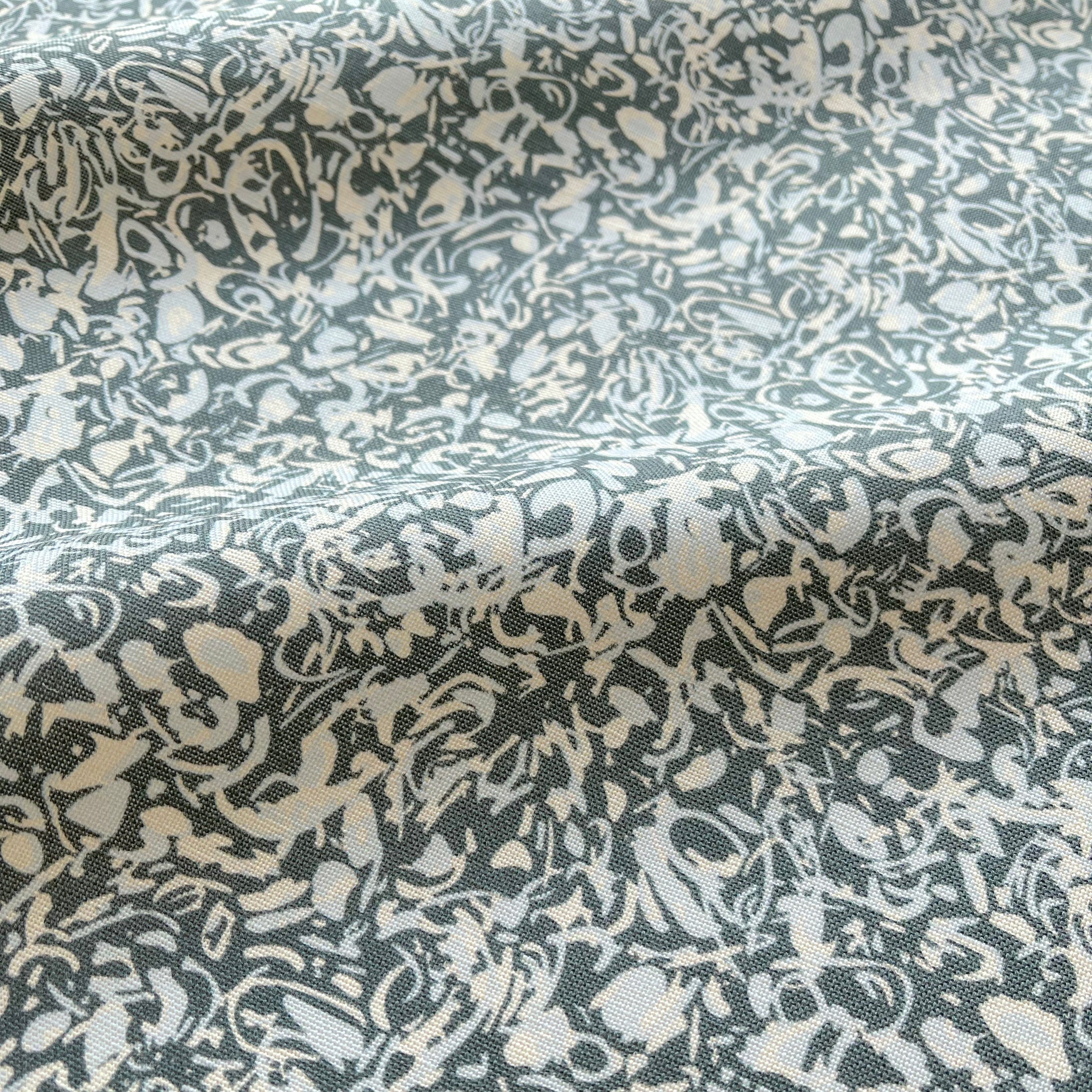 Estuary pillow in Peacock – close-up of fabric texture and linear pattern from the Waterways Collection