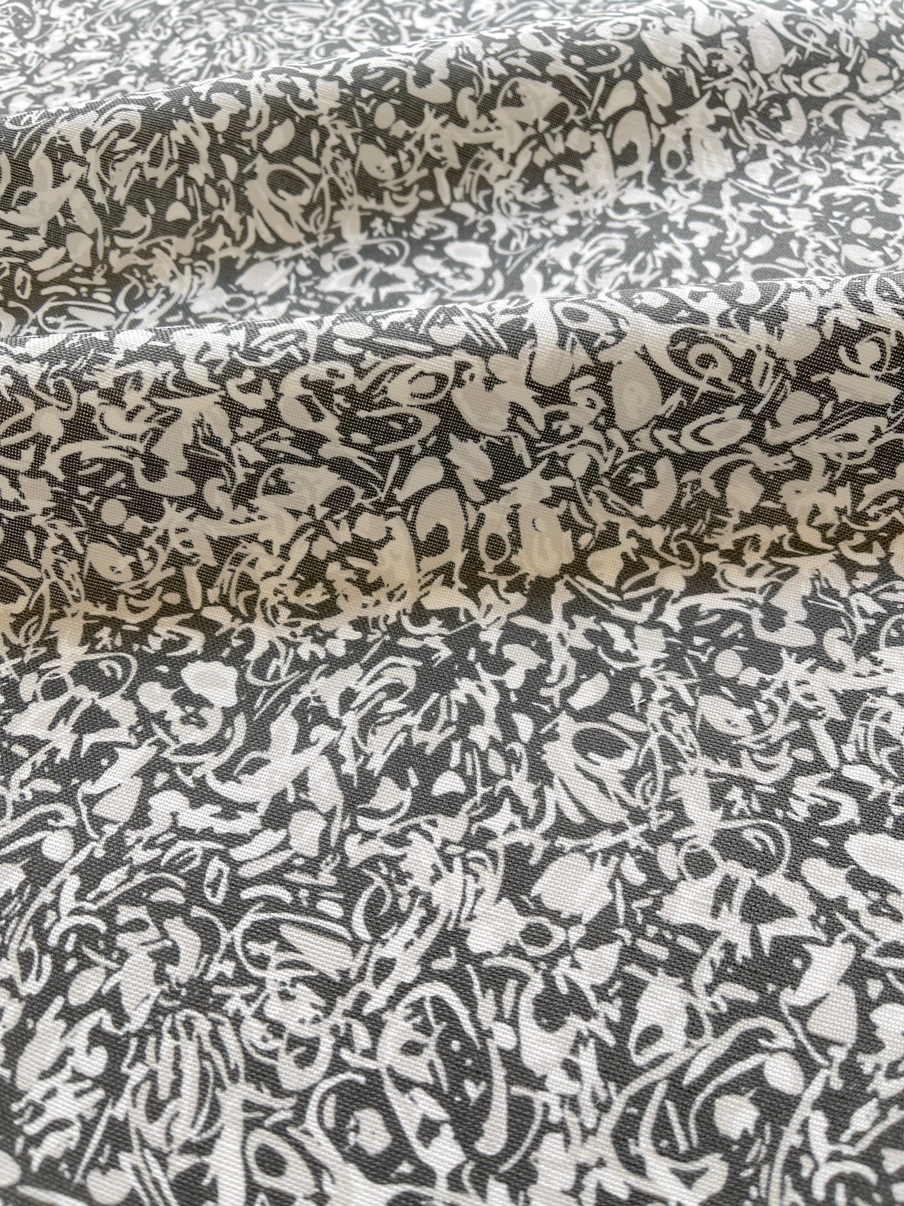 Estuary pillow in Granite – close-up of fabric texture and linear pattern from the Waterways Collection