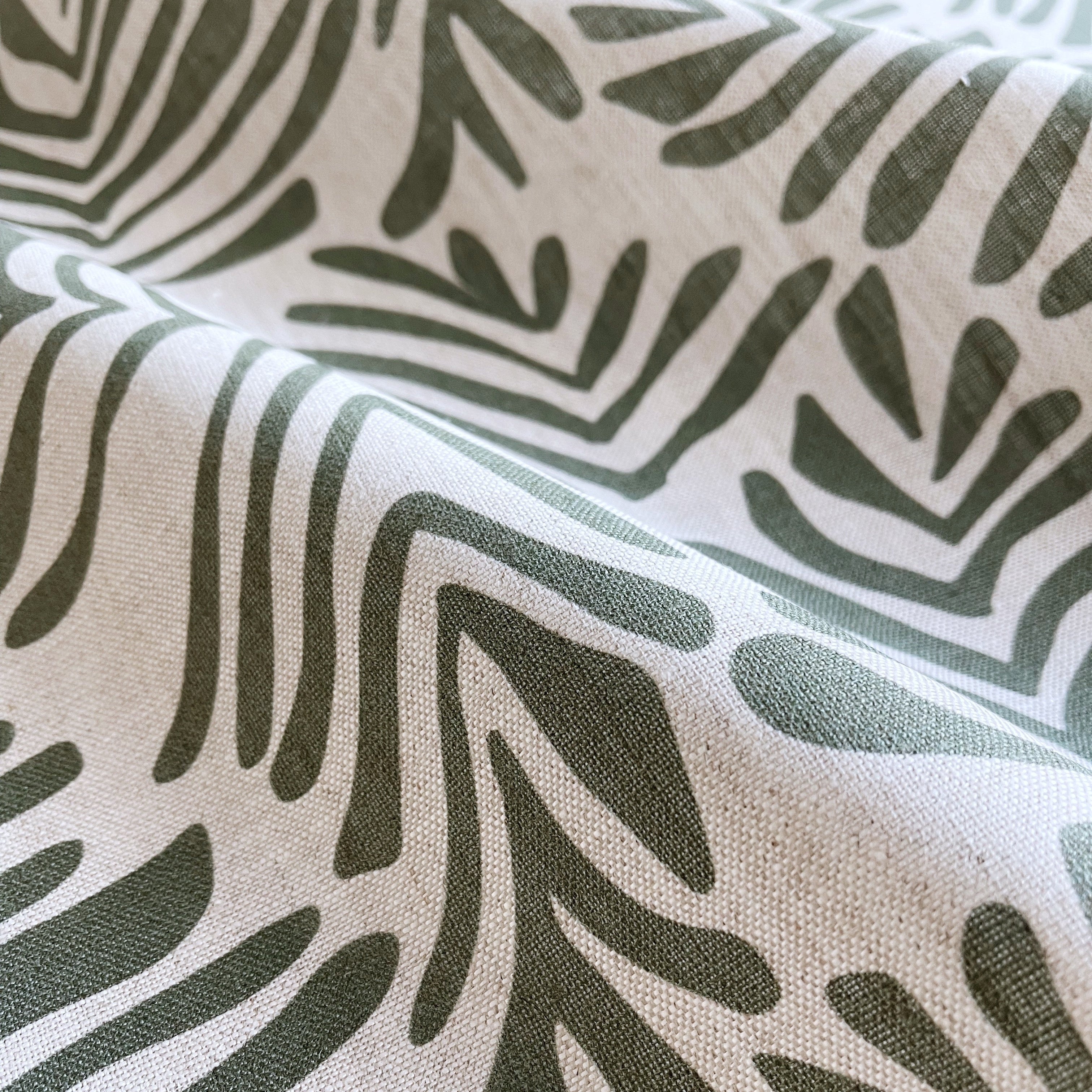 Frond fabric in Alpine – close-up of linen texture and leafy pattern; perfect for pattern sofas