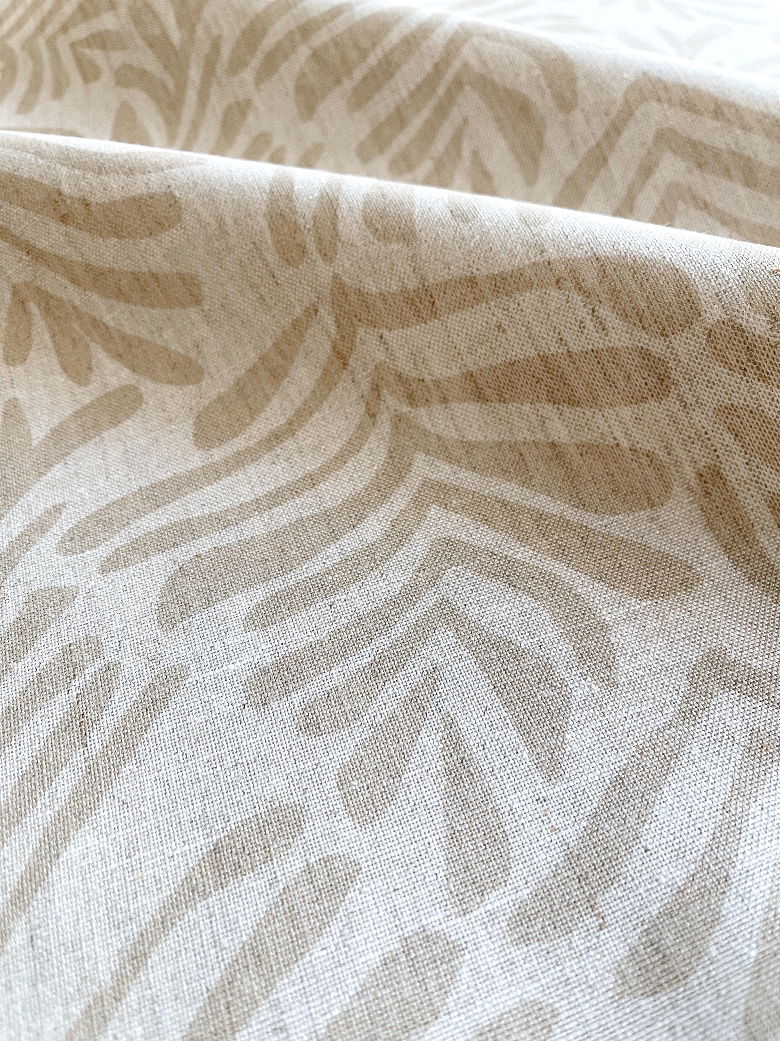 Frond fabric in Truffle – close-up of linen texture and leafy pattern; perfect for pattern sofas