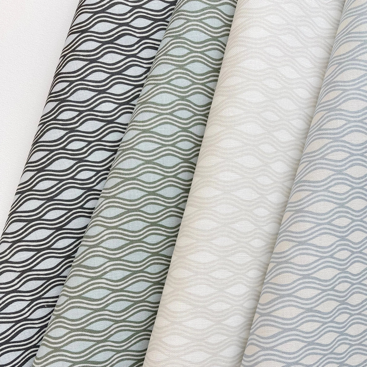 Inlet fabric in Beach by Emily Daws styled in an interior — Waterways Collection