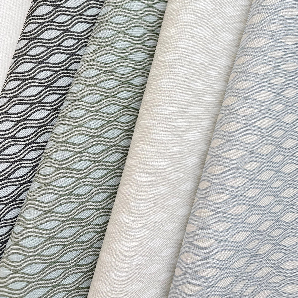 Inlet fabric in Juniper by Emily Daws styled in an interior — Waterways Collection
