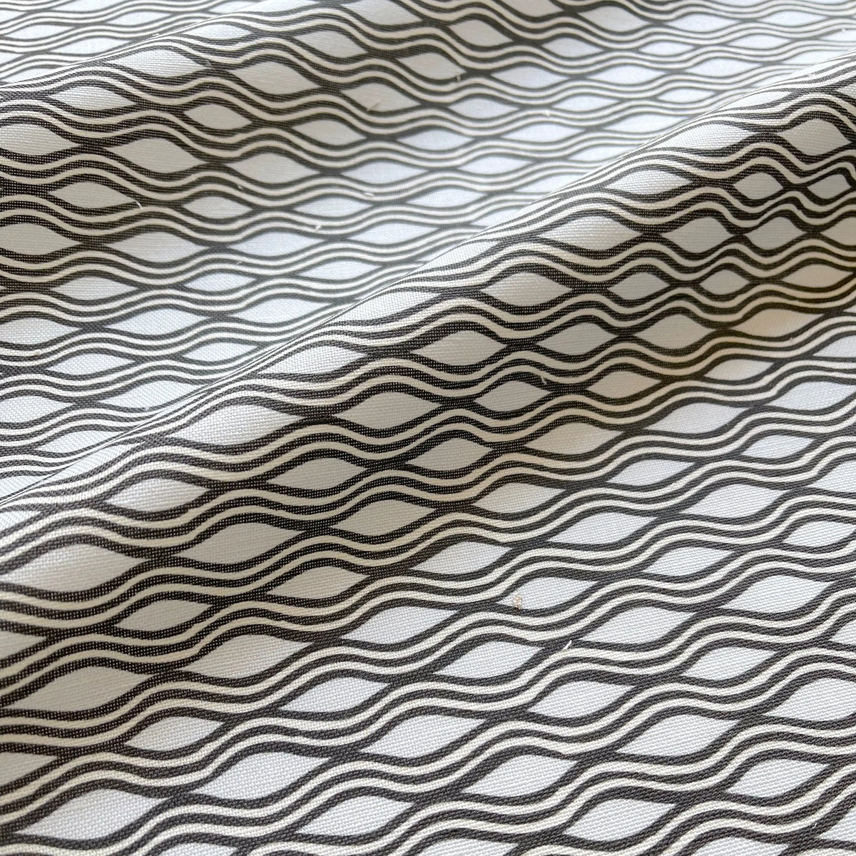 Inlet Shadow pillow by Emily Daws styled in an interior — Waterways Collection