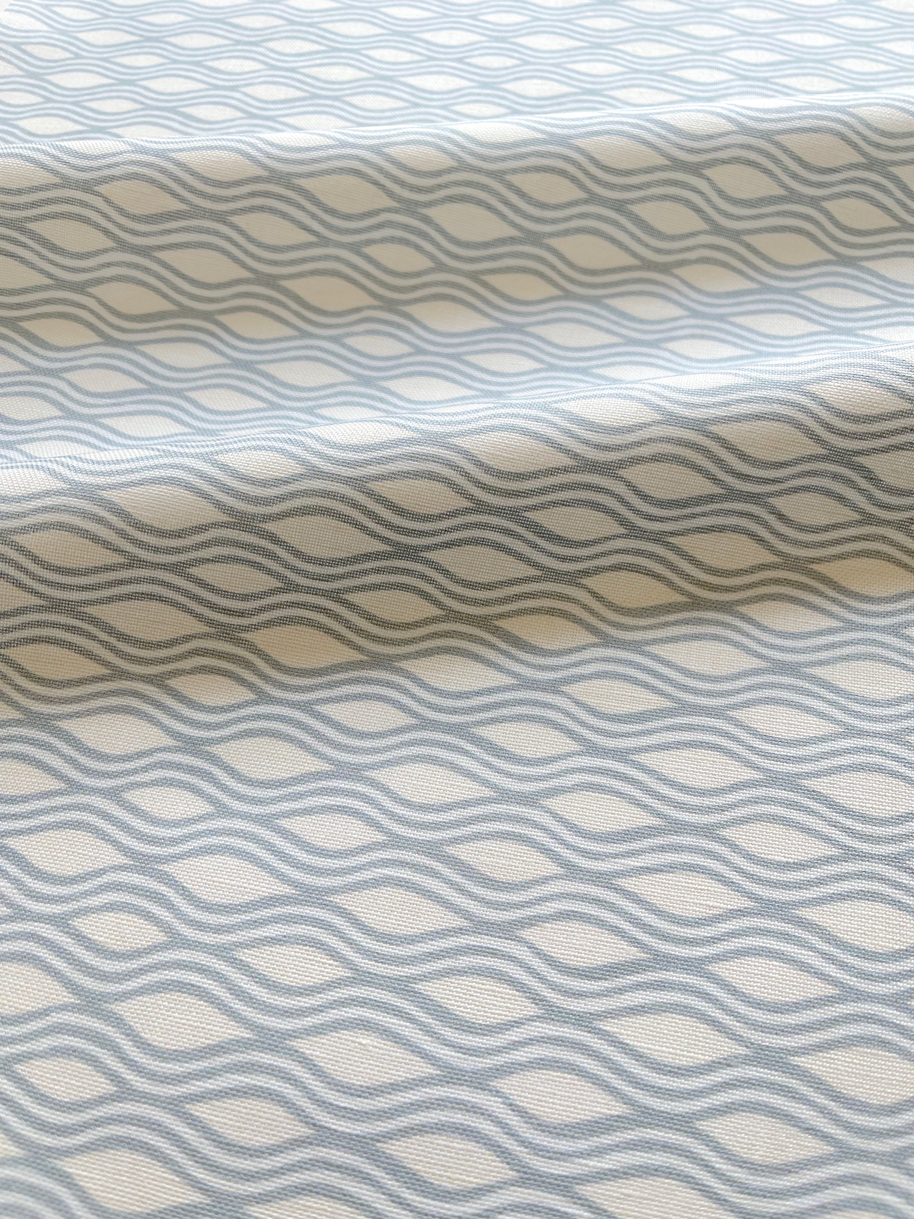 Inlet pillow in Cloud – close-up of fabric texture and linear pattern from the Waterways Collection