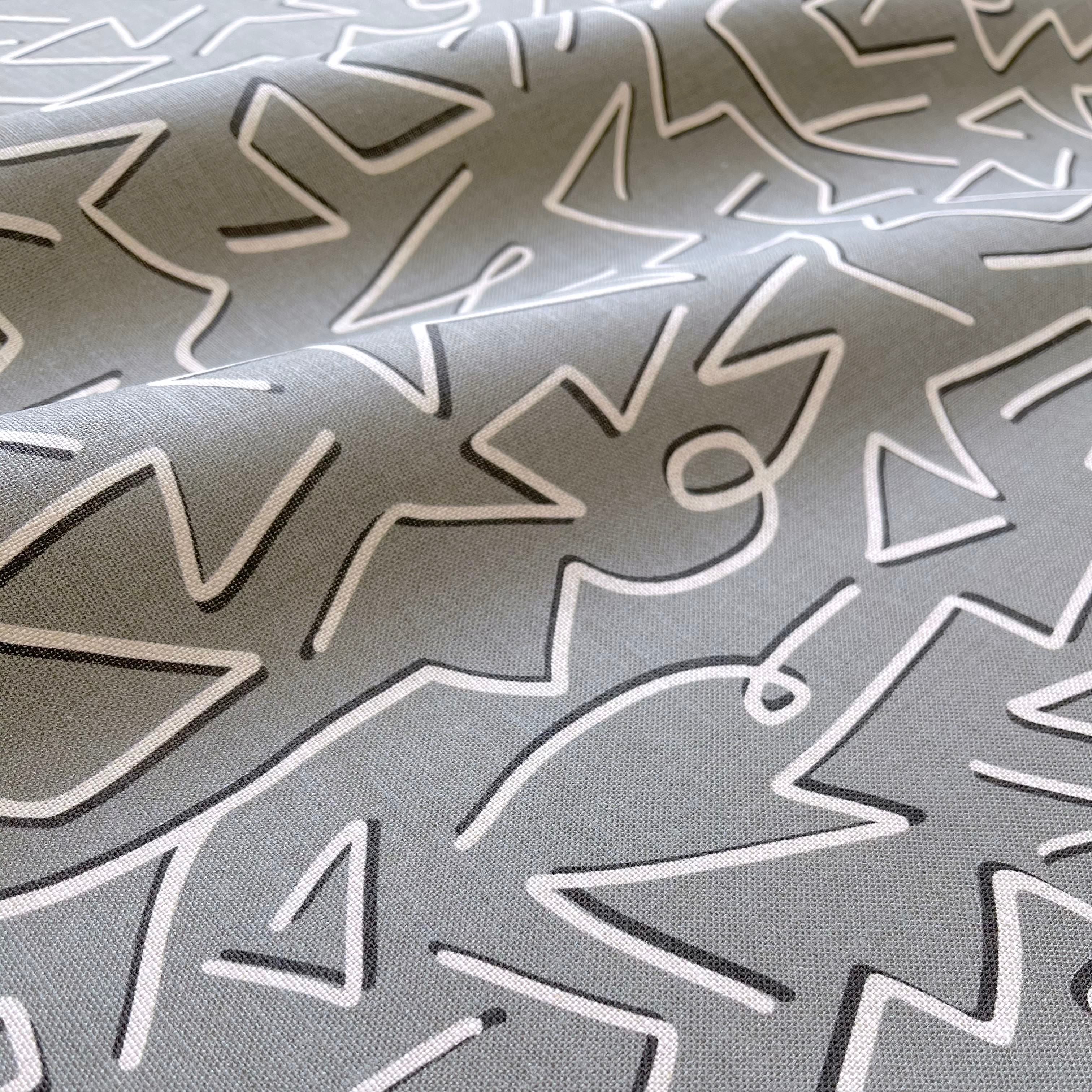 Custom linen fabric by Emily Daws, suitable for window treatments, pillows, and wallcoverings in boutique interiors.