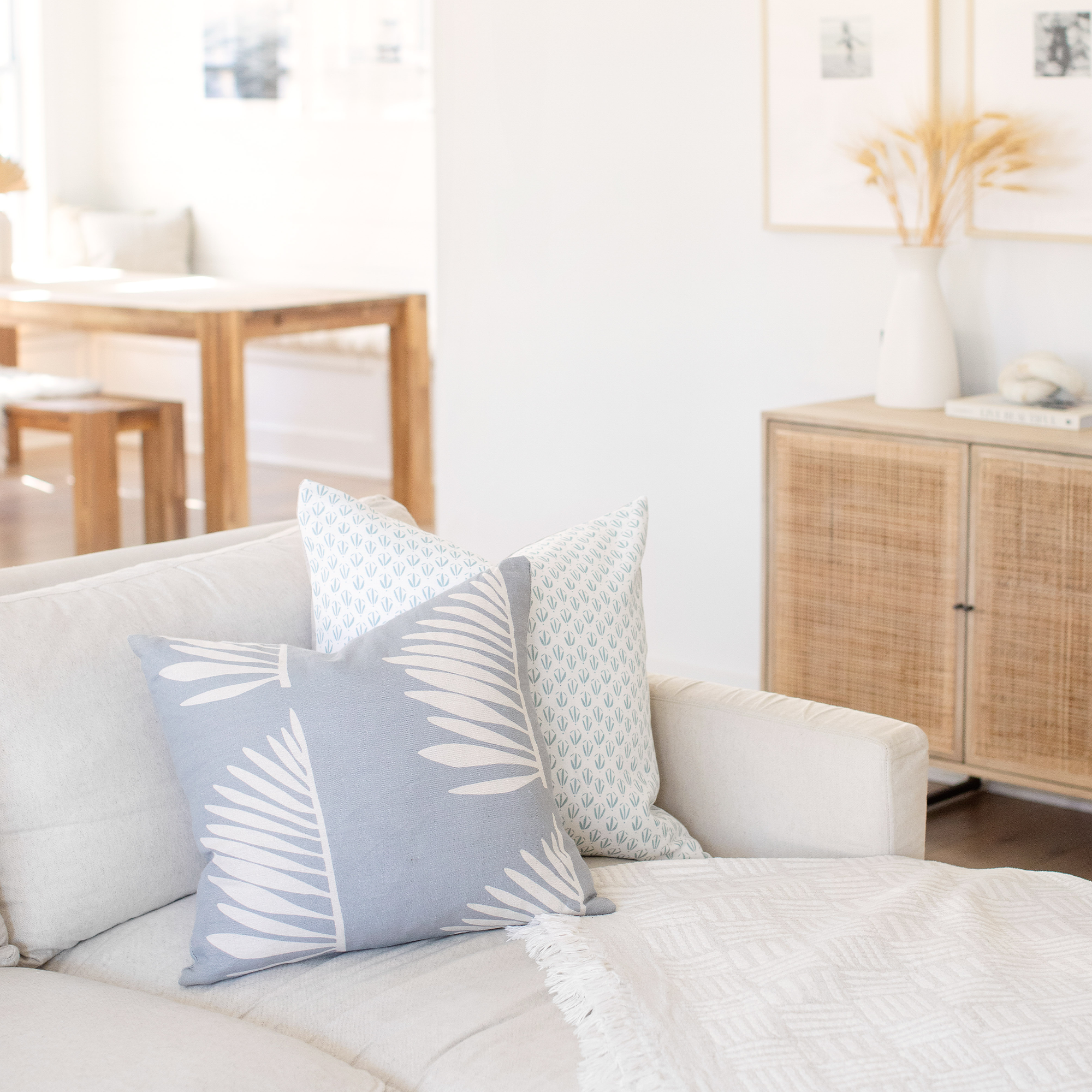 Sofa styled with Emily Daws pillows in Belgian linen, made in the South for luxury interiors.
