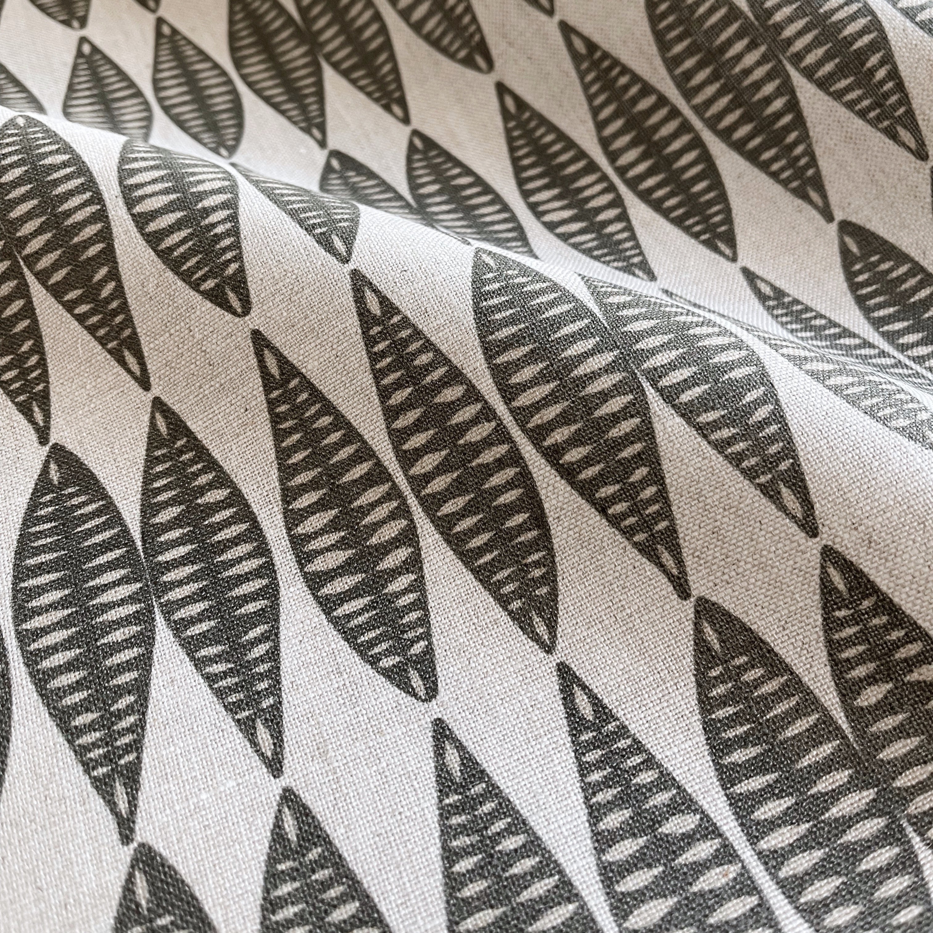 Leaflette pillow in Peppercorn β fabric detail showing botanical print and linen texture from Flora Collection