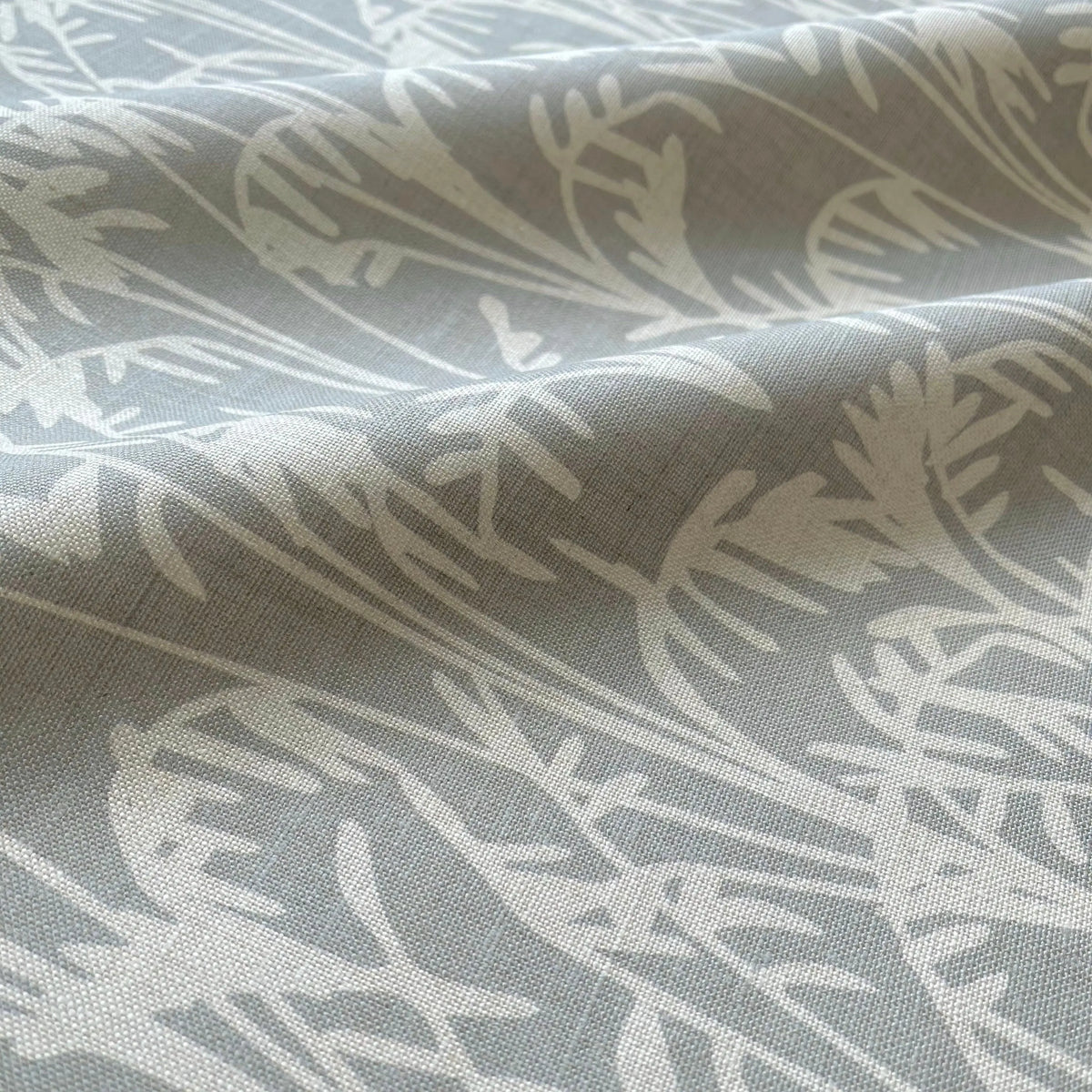 Seabrook Ii Pistachio pillow by Emily Daws styled in an interior — Sea Island Collection