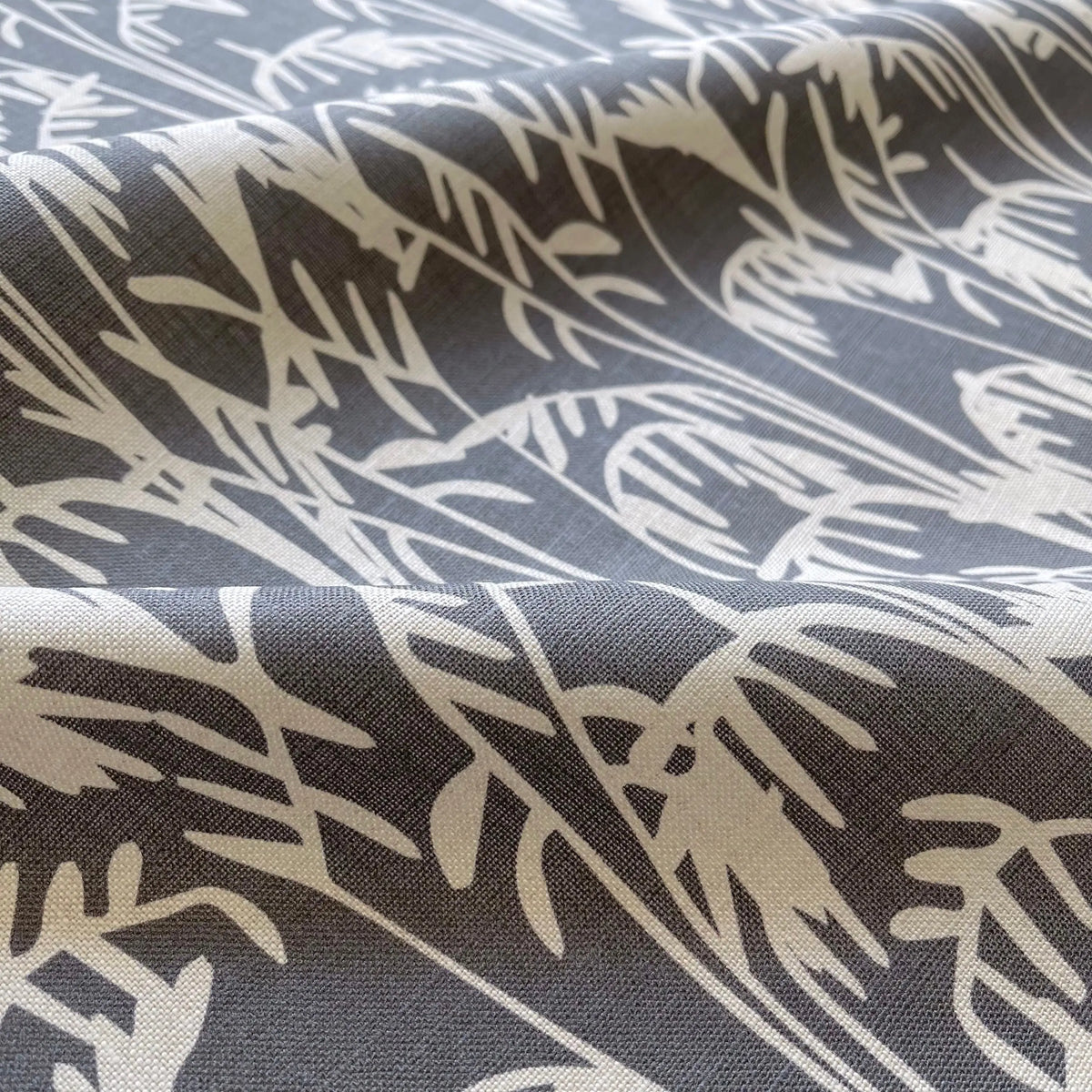 Seabrook Ii Storm pillow by Emily Daws styled in an interior — Sea Island Collection