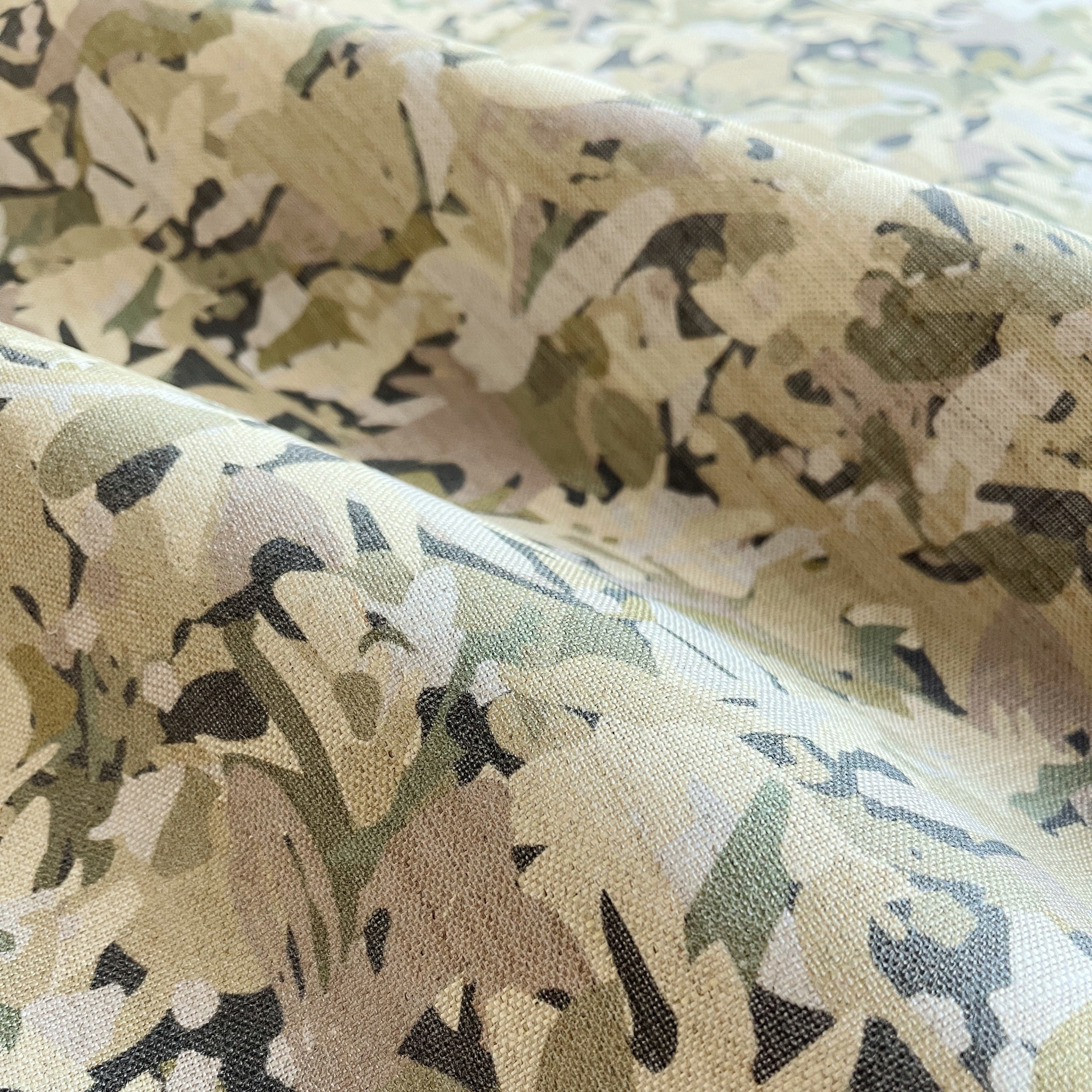 Thicket pillow in Sundrop β fabric detail showing botanical print and linen texture from Flora Collection