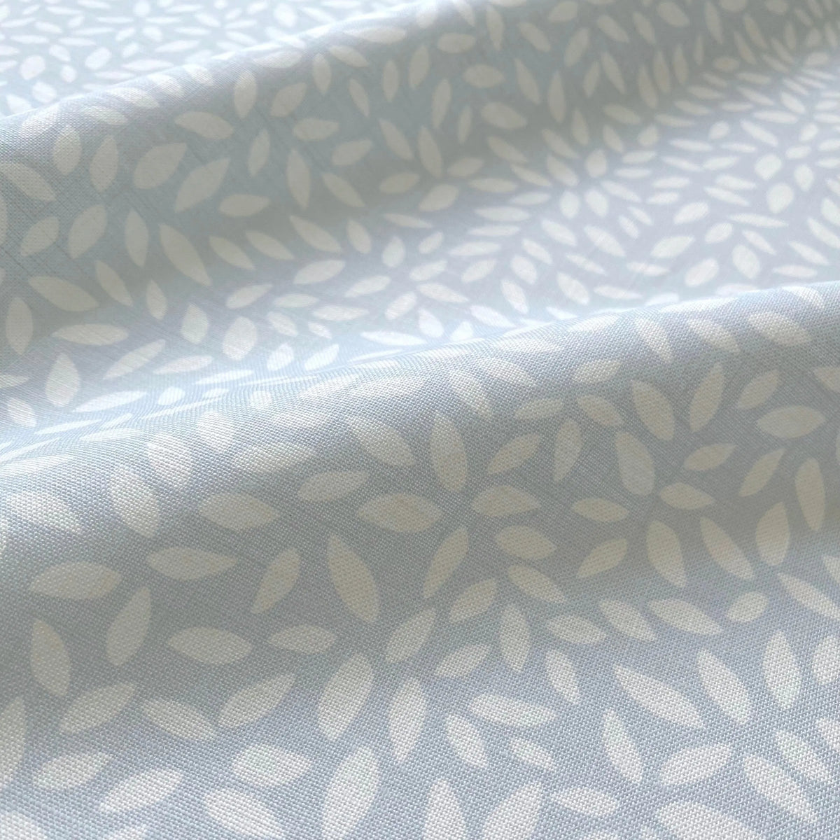 Wadmalaw Sky pillow by Emily Daws styled in an interior — Sea Island Collection