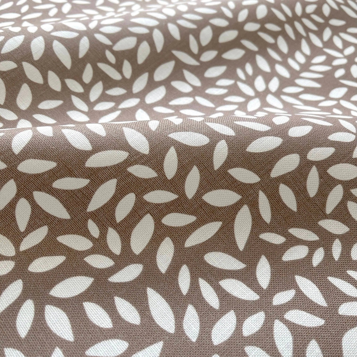 Wadmalaw Tea pillow by Emily Daws styled in an interior — Sea Island Collection
