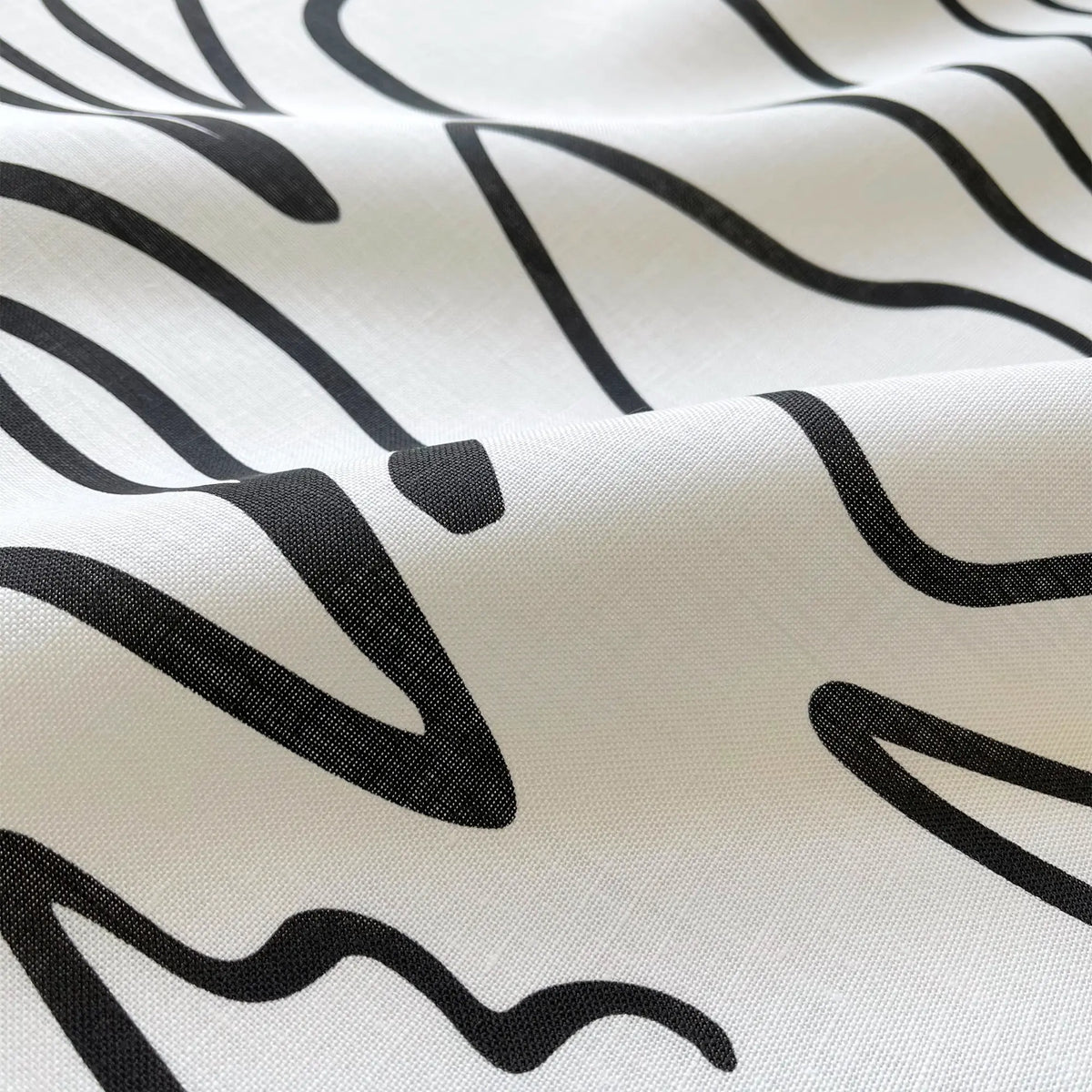 Edisto Jet pillow by Emily Daws styled in an interior — Sea Island Collection