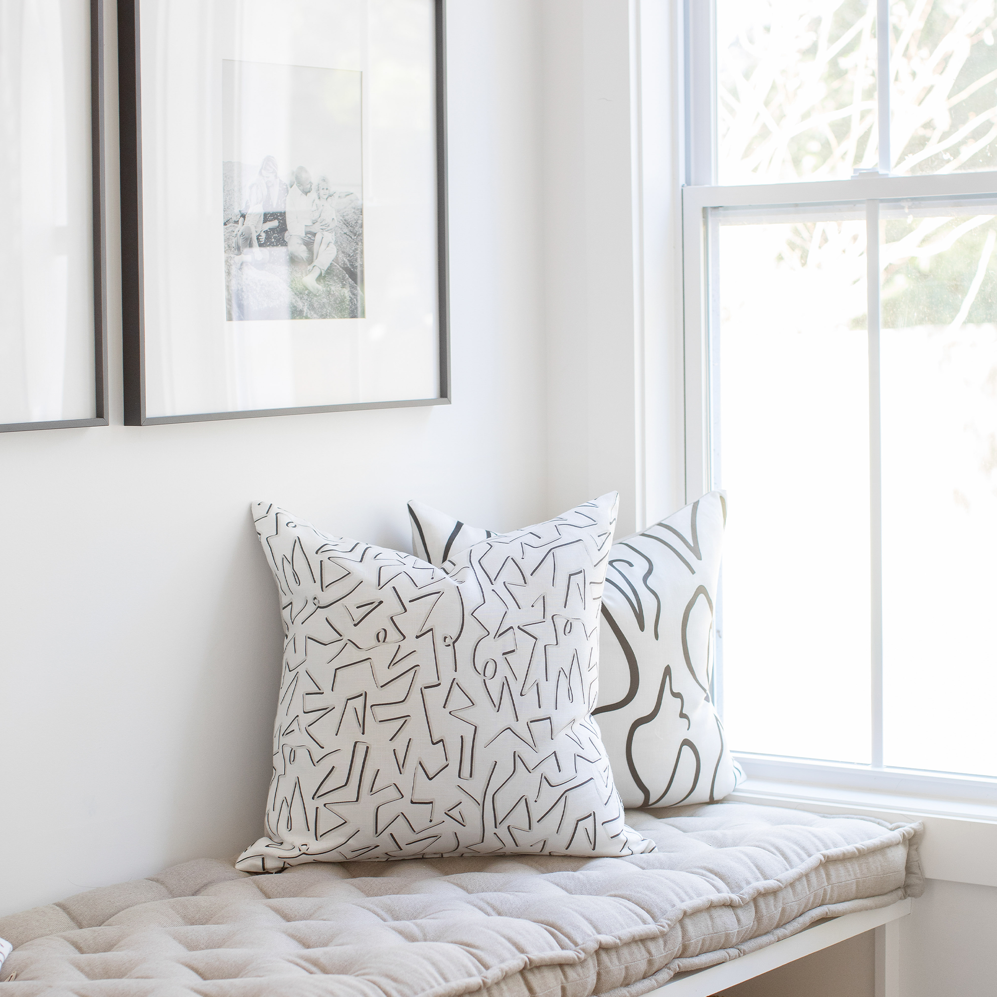 Decorative pillow pairing by Emily Daws, styled in boutique fabrics for bespoke home interiors.