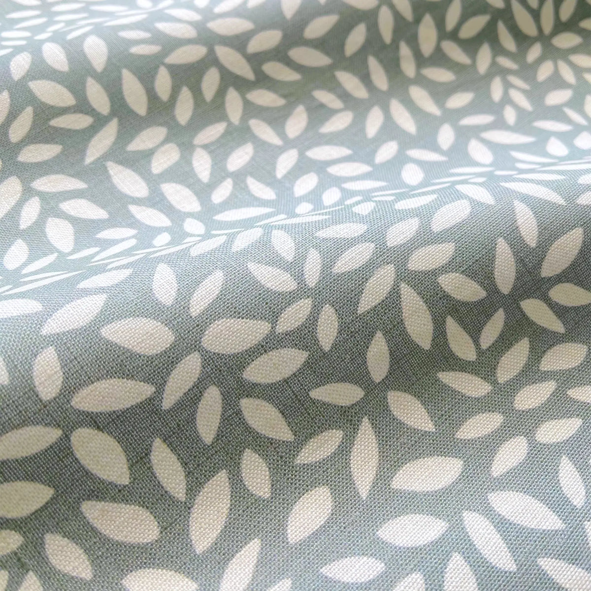 Wadmalaw Sage pillow by Emily Daws styled in an interior — Sea Island Collection