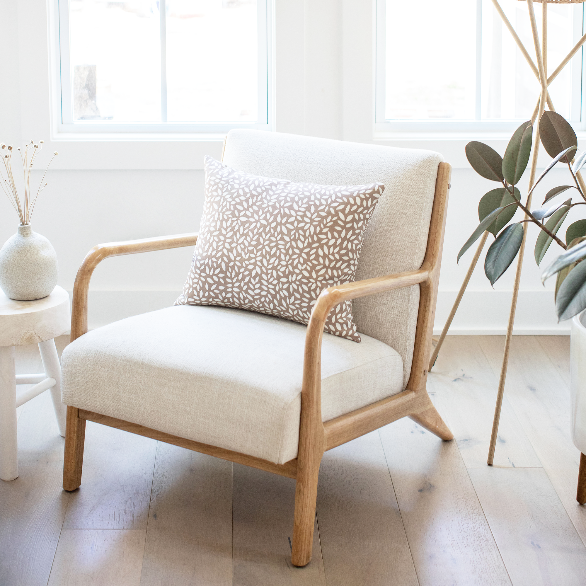 Emily Daws Wadmalaw pillow on a chair, crafted in linen fabrics and styled for classic, artful Southern interiors.