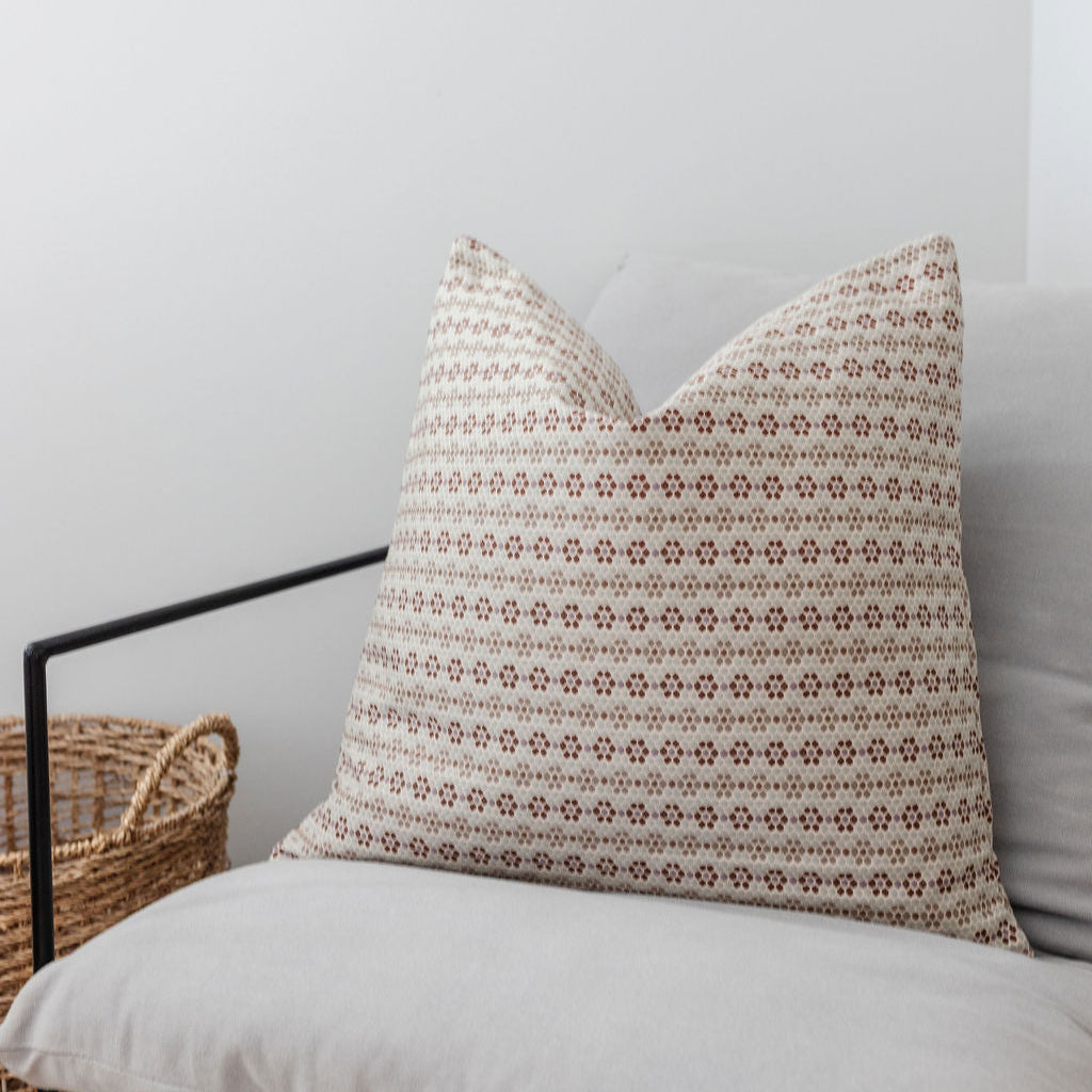 Emily Daws Nectar pillow in Sugar Plum styled on a chair, crafted woven fabrics and styled for classic, artful Southern interiors.