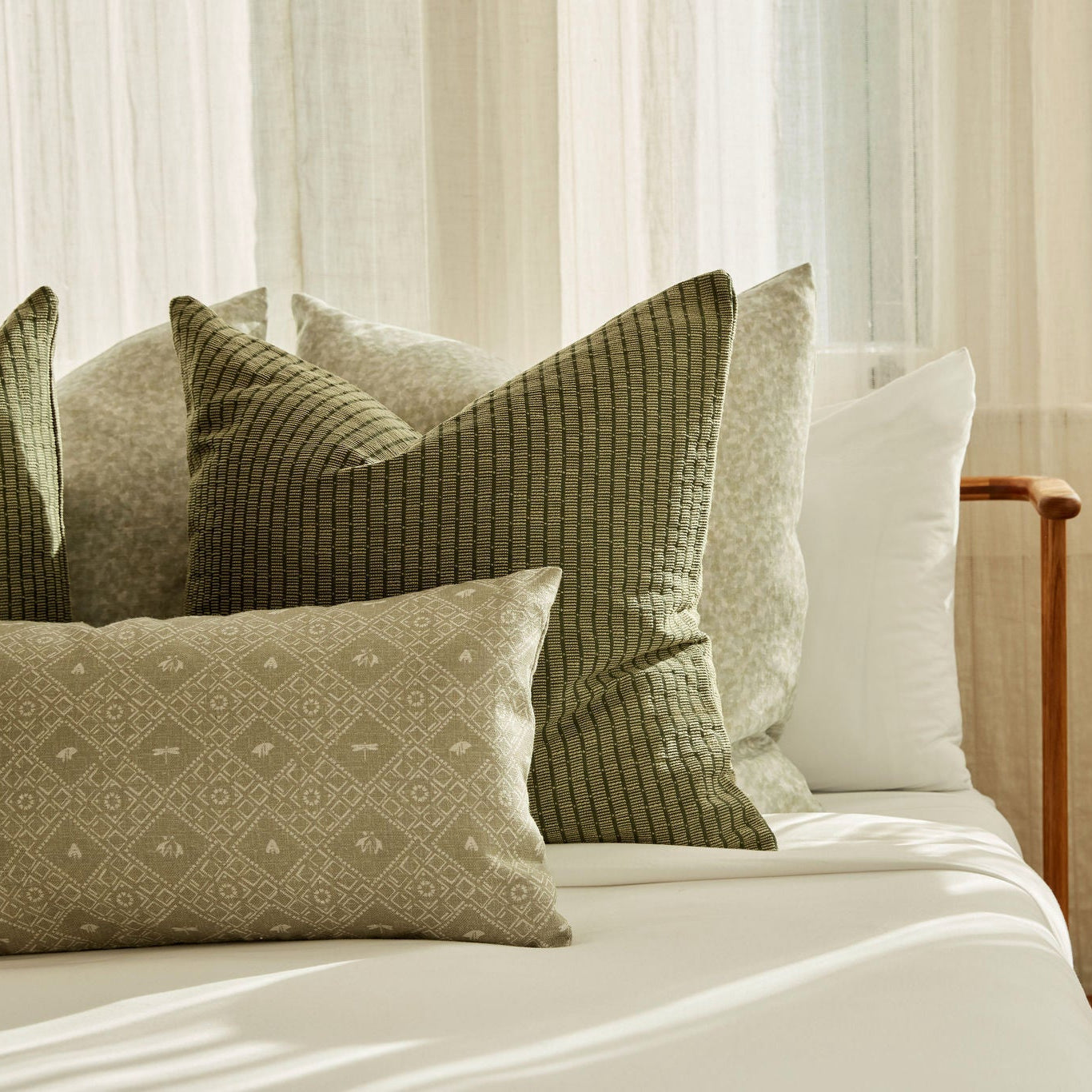 Decorative pillow grouping by Emily Daws featuring small-batch fabrics and Southern-inspired design details.