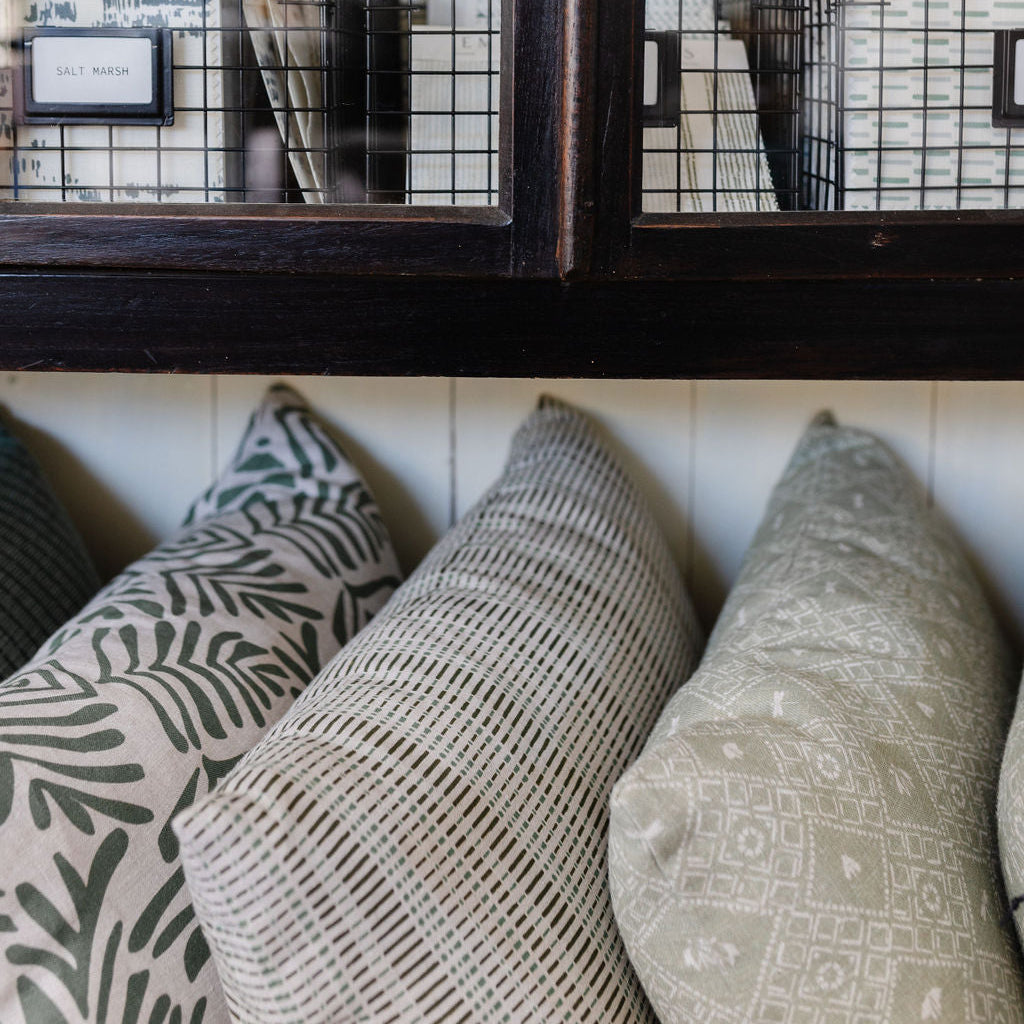 Decorative pillow grouping by Emily Daws featuring small-batch fabrics and Southern-inspired design details.