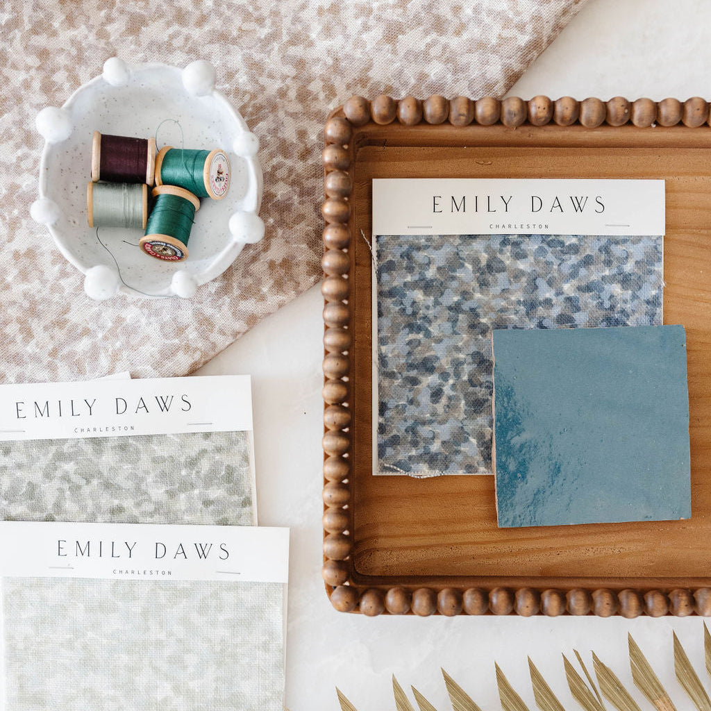Custom linen fabric by Emily Daws, suitable for window treatments, pillows, and wallcoverings in boutique interiors.