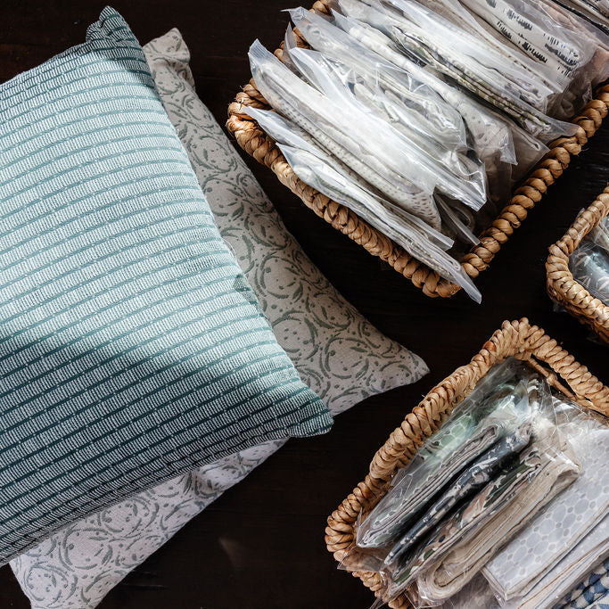 Decorative pillow grouping by Emily Daws featuring small-batch fabrics and Southern-inspired design details.