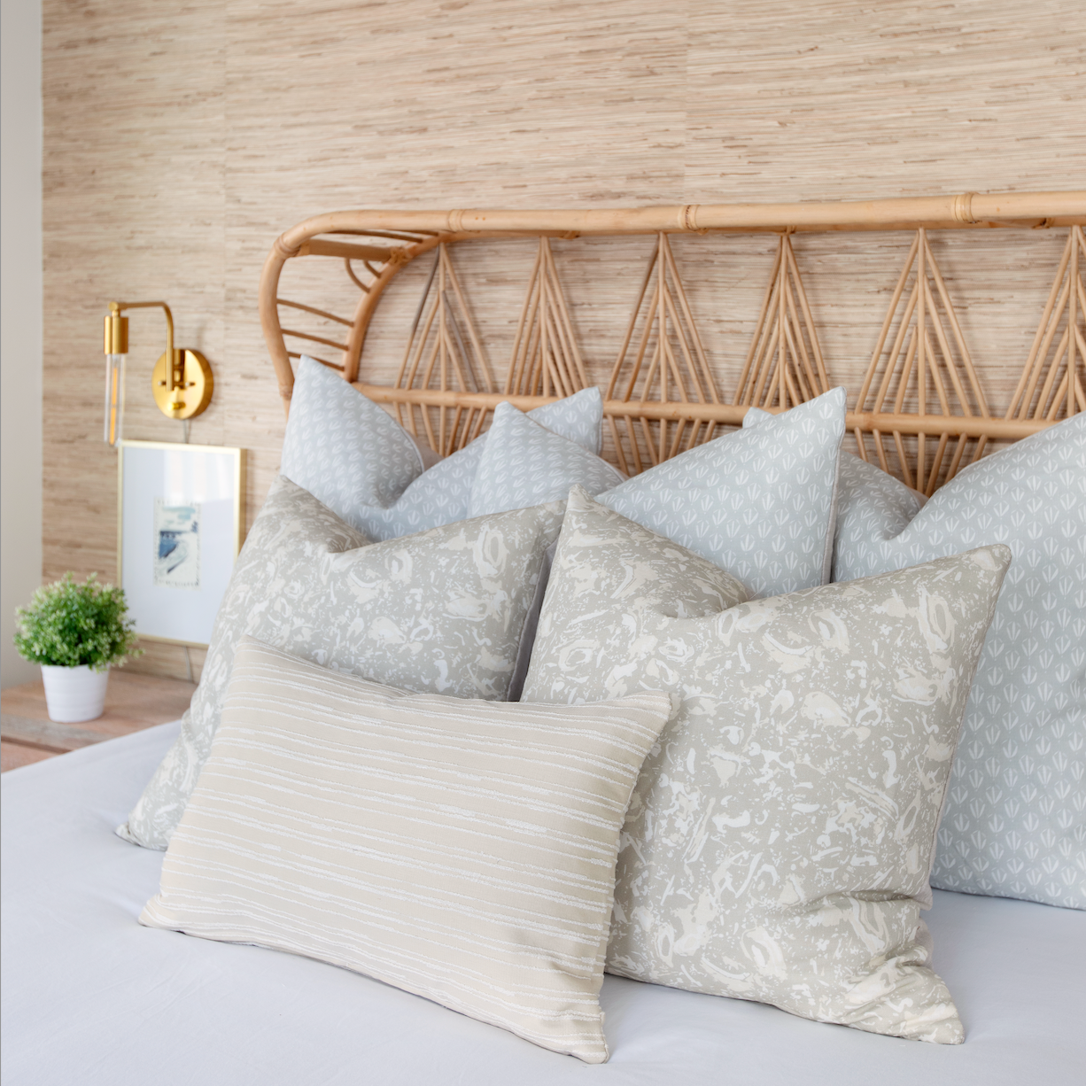 Emily Daws pillows displayed in a Charleston-inspired interior, styled with luxury textiles for artful living spaces.