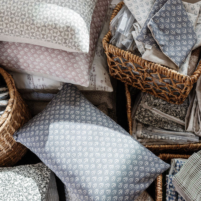 Decorative pillow grouping by Emily Daws featuring small-batch fabrics and Southern-inspired design details.