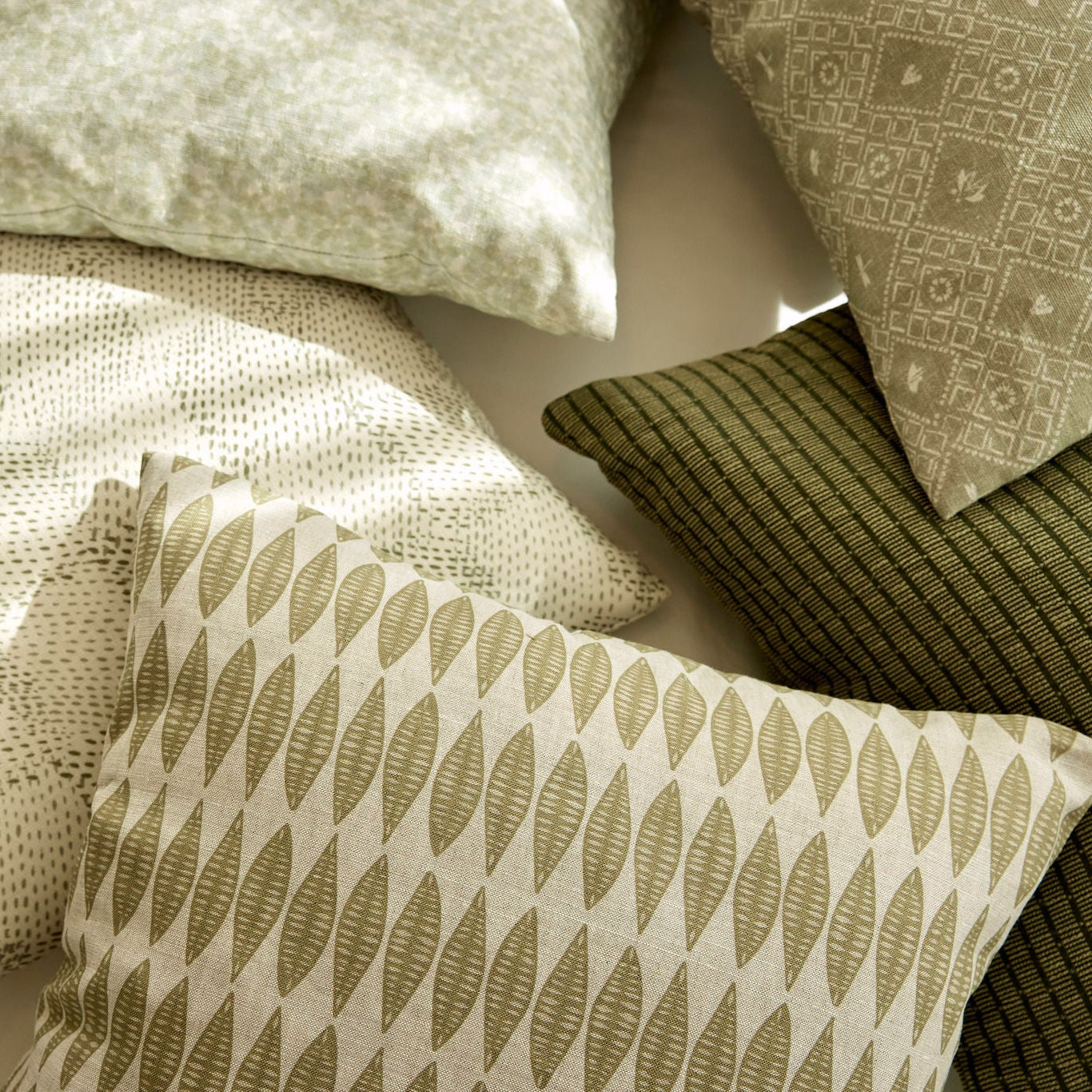 Decorative pillow grouping by Emily Daws featuring small-batch fabrics and Southern-inspired design details.
