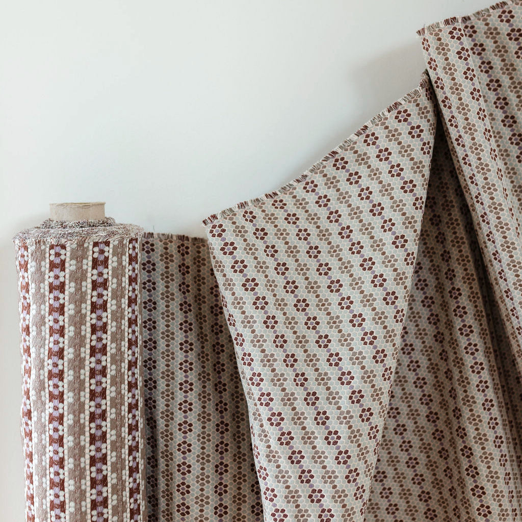 Small-batch fabric by Emily Daws created for interior designers seeking artisanal wallcoverings, pillows, and textiles.