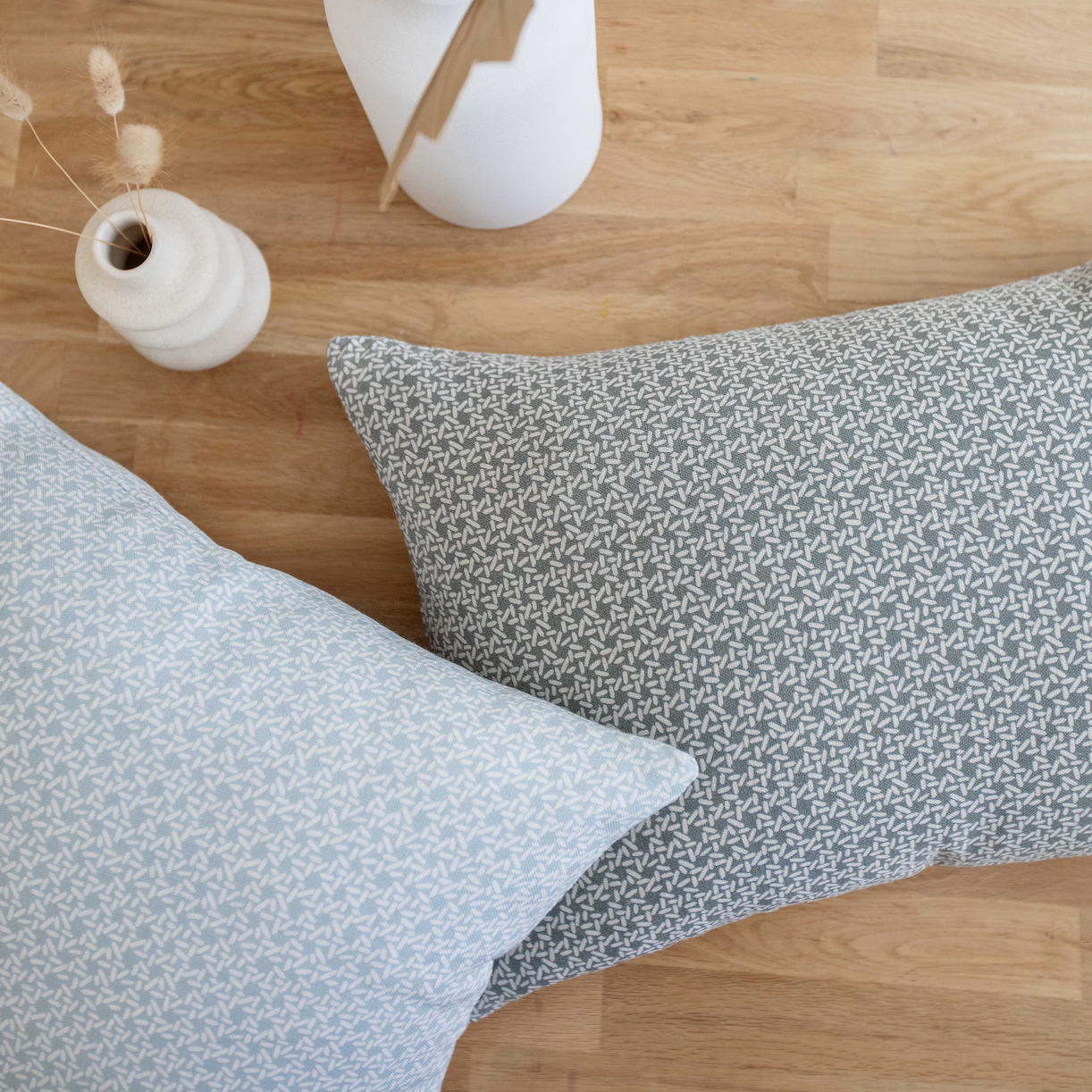 Pair of Emily Daws pillows, crafted in linen fabrics and styled for classic, artful Southern interiors.