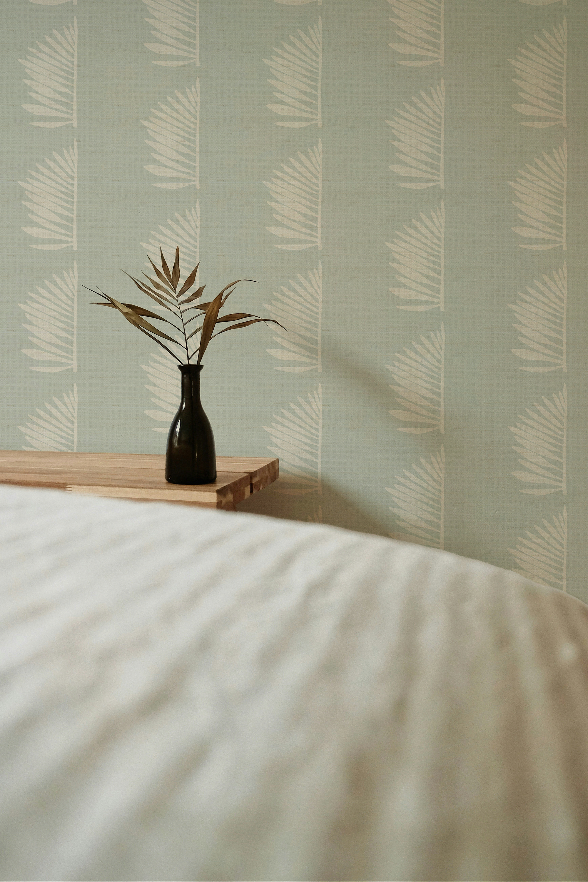 Palmetto Grasscloth wallpaper in Haint Blue styled by Emily Daws – shown in a Charleston home entryway