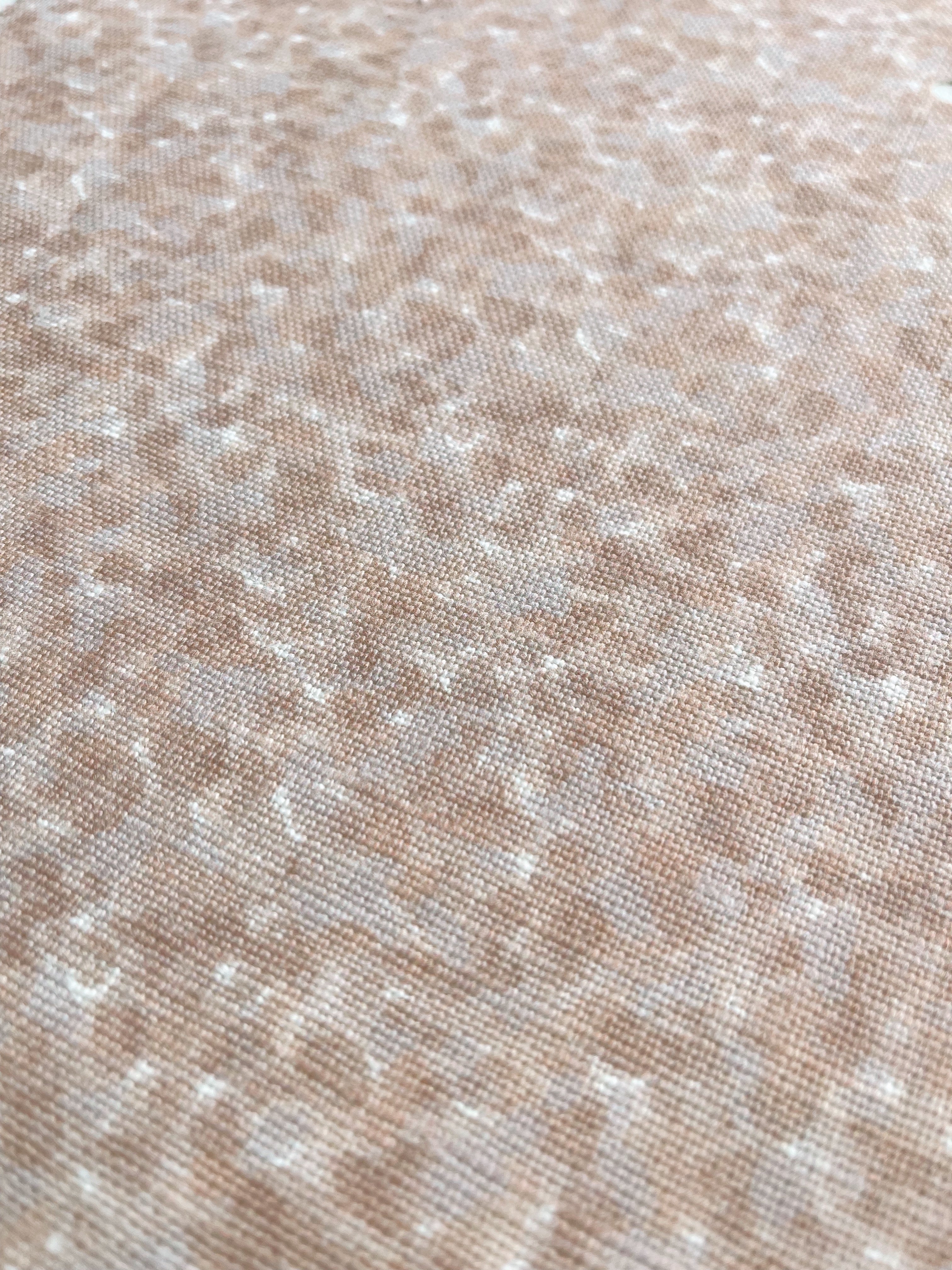Tortoise pillow in Taffy – close-up of natural linen and pattern from the Fauna Collection