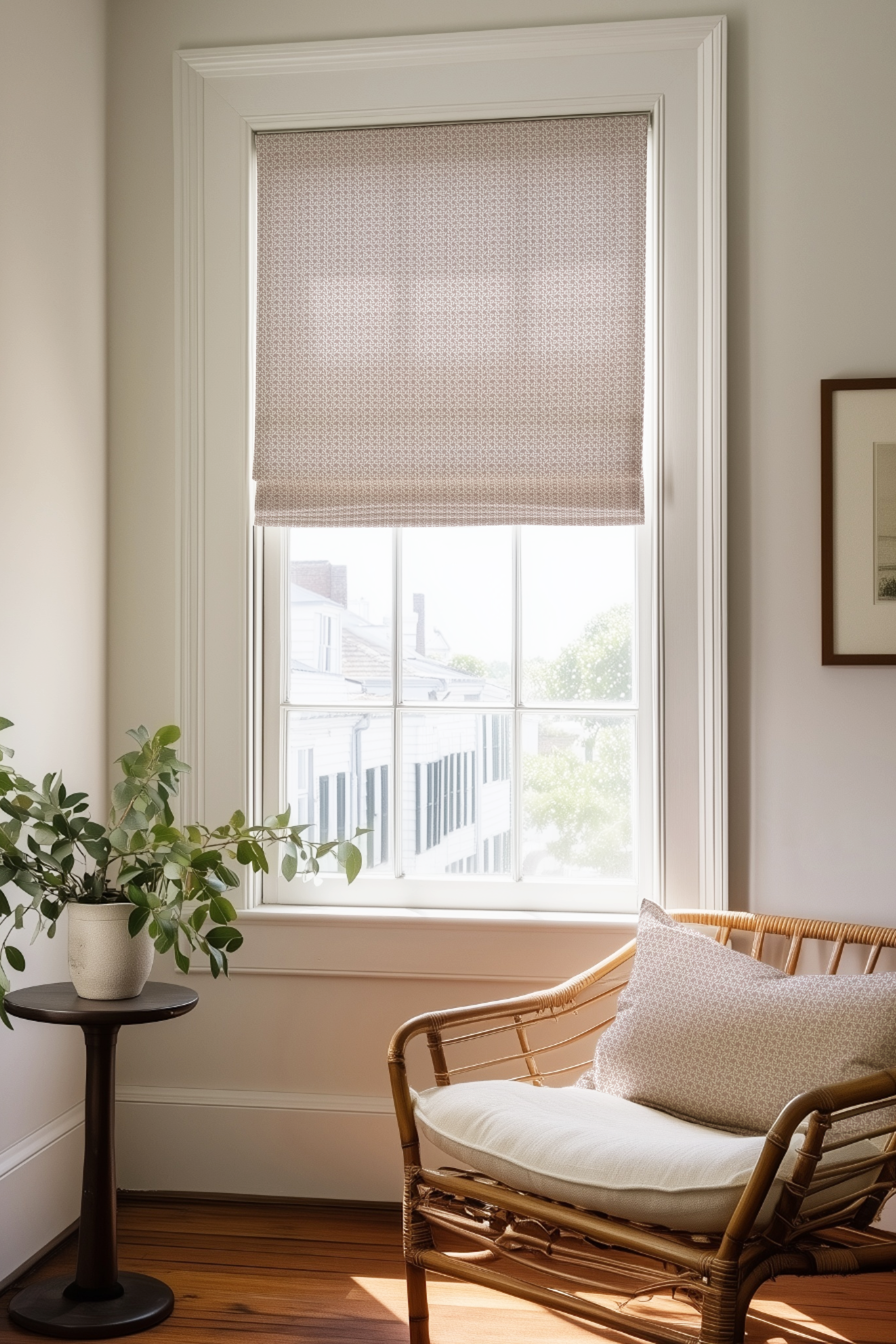 Corner of a bedroom in a Charleston home with a Roman shade and pillow in Carolina Rice fabric in Blush by Emily Daws.