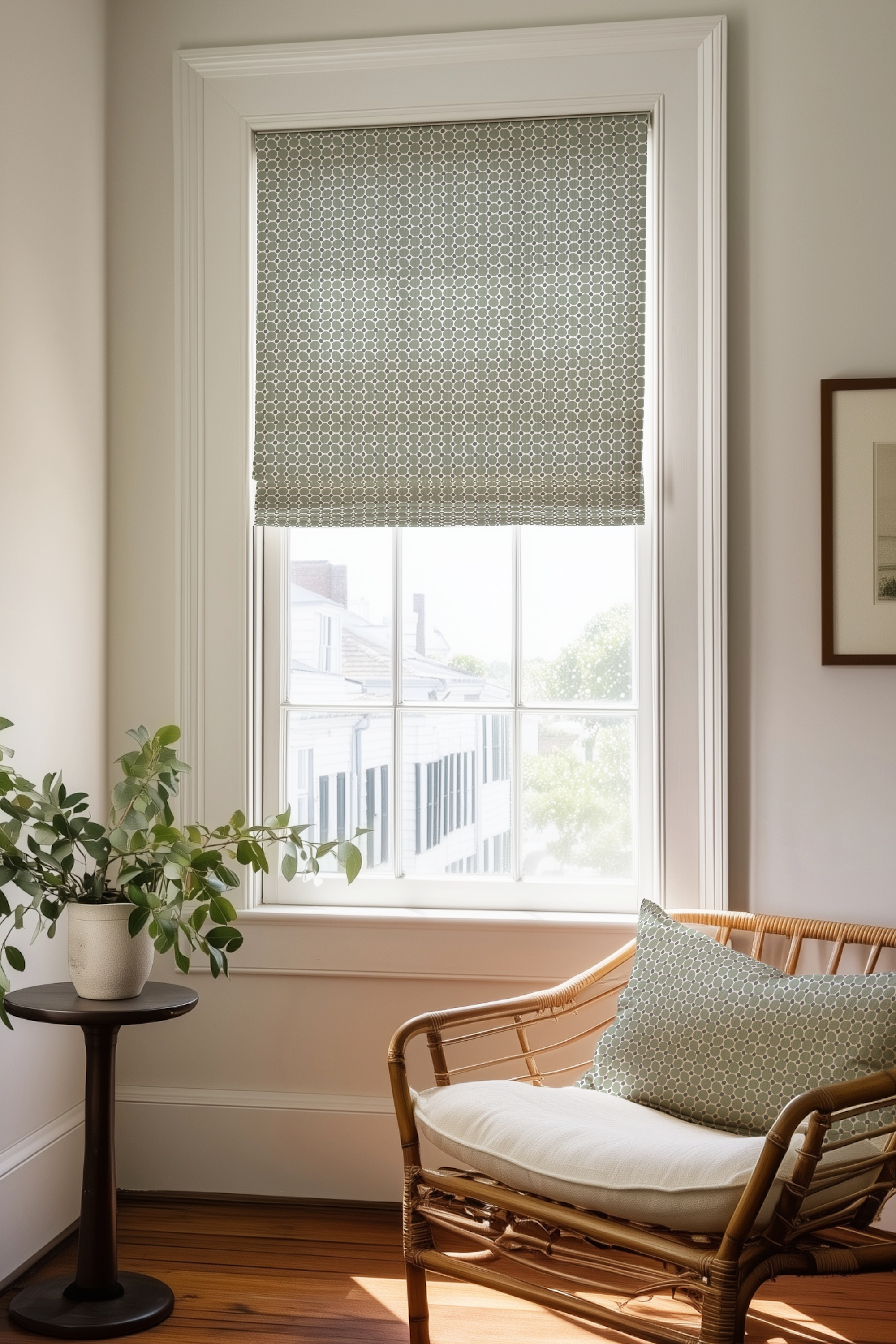 Corner of a bedroom in a Charleston home with a Roman shade and pillow in Cobblestone fabric in Olive by Emily Daws.