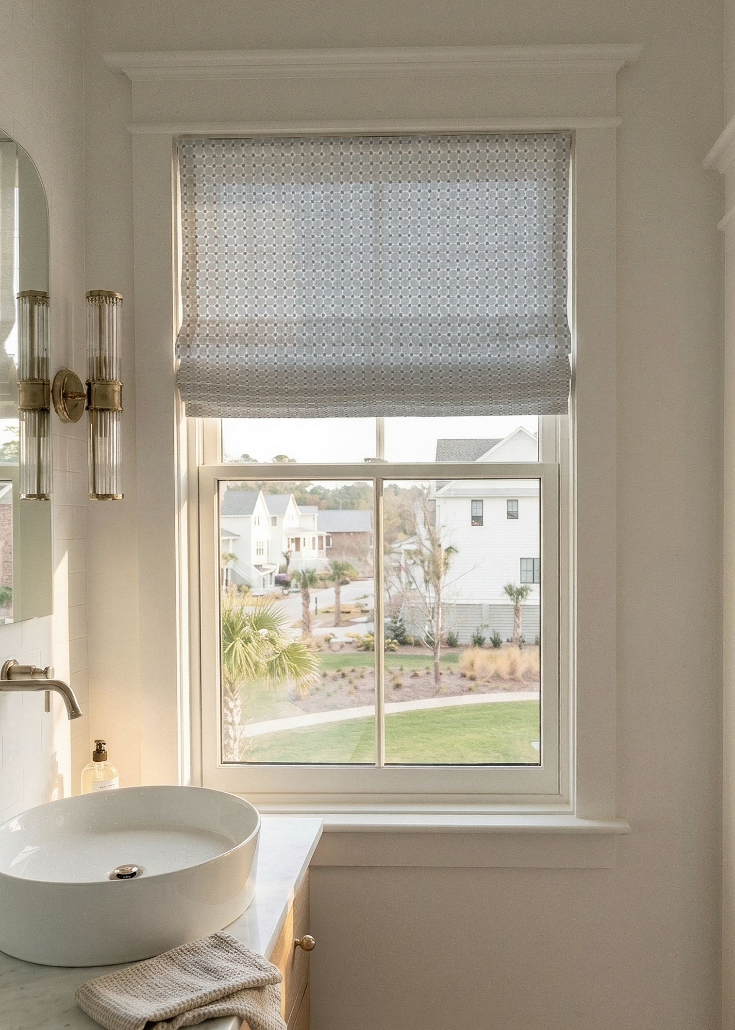 Bathroom window with decorative roman shade in Emily Daws printed linen fabric - Cobblestone in Sea Salt.