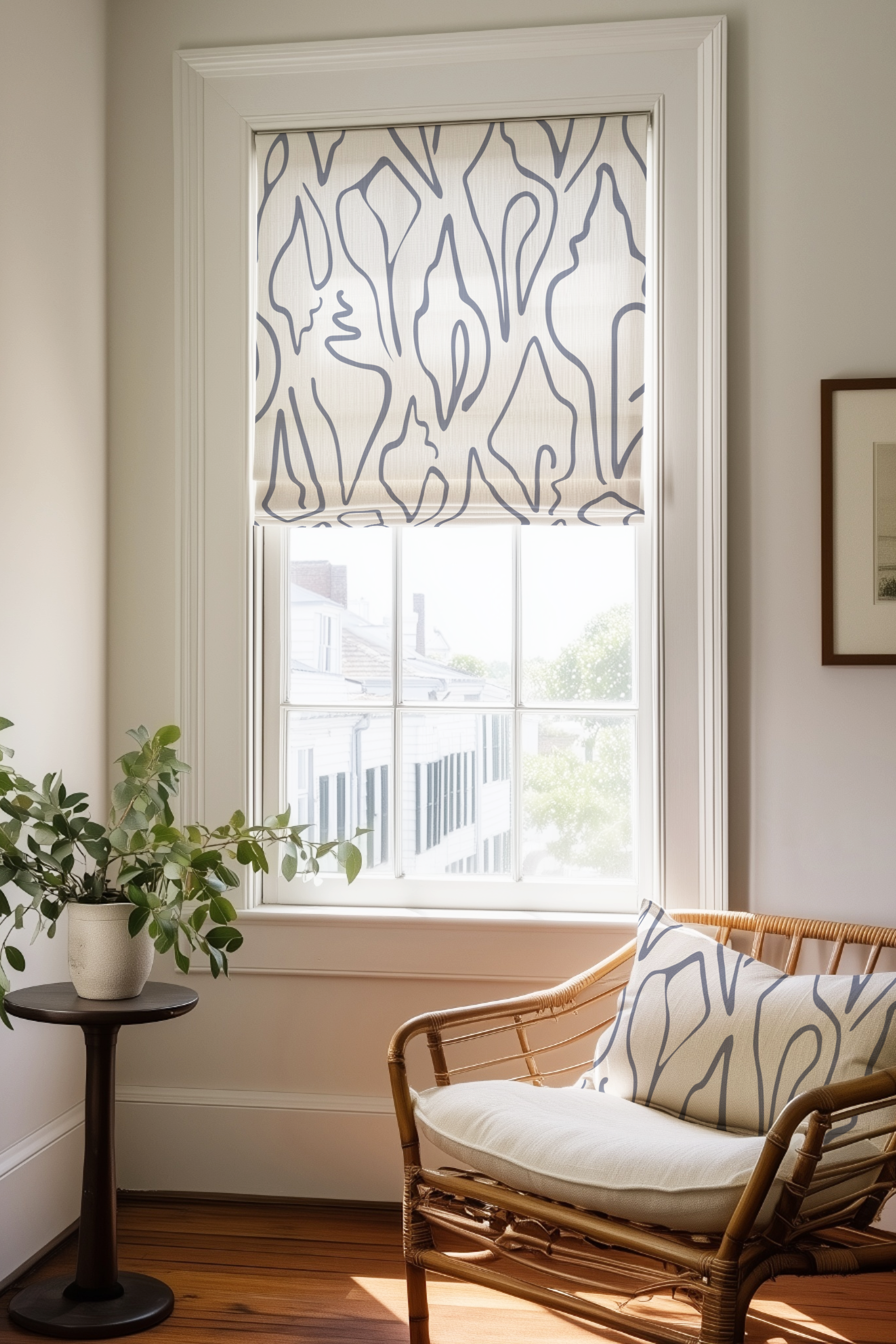 Corner of a bedroom in a Charleston home with a Roman shade and pillow in Edisto fabric in Ink by Emily Daws.