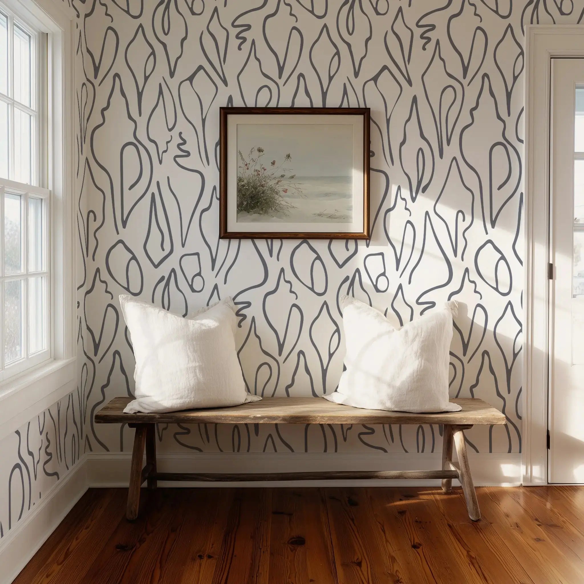 Room interior with a bench against a wall featuring abstract shell wallpaper by Emily Daws.
