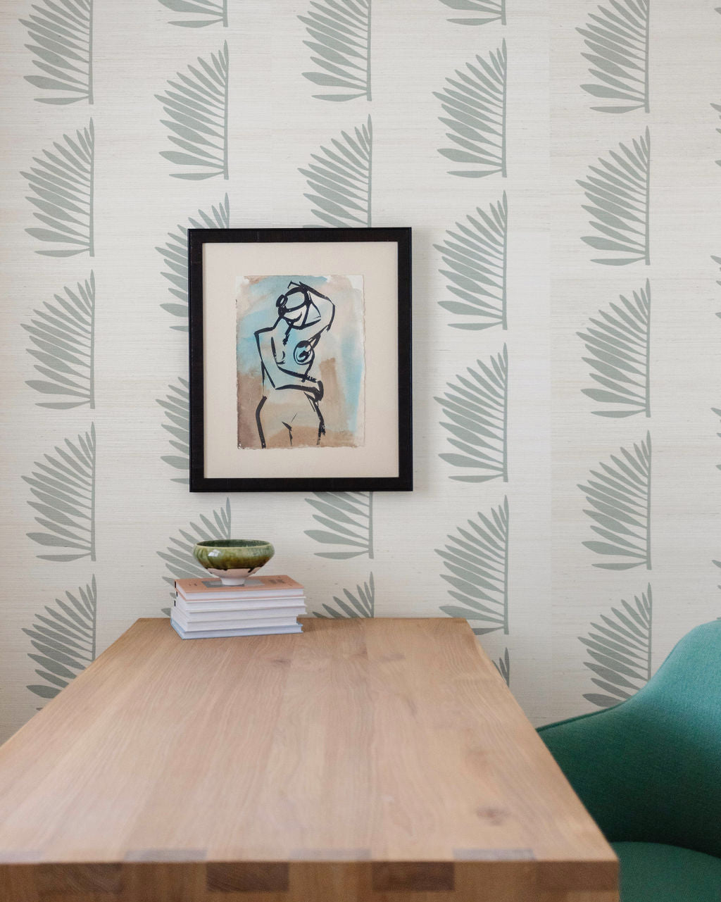 Grasscloth wallpaper with a palm frond leaf motif designed in Charleston by Emily Daws