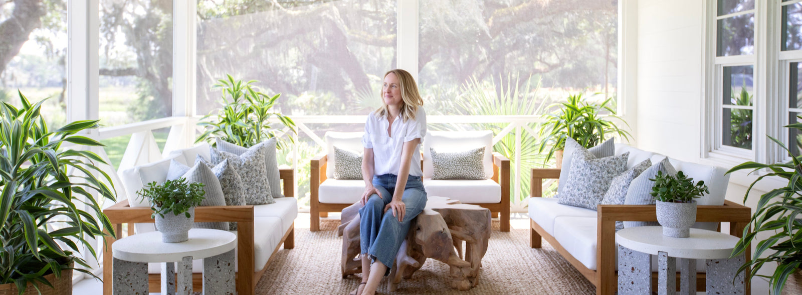 An image of Emily Daws on the porch of the Kiawah River Farmhouse