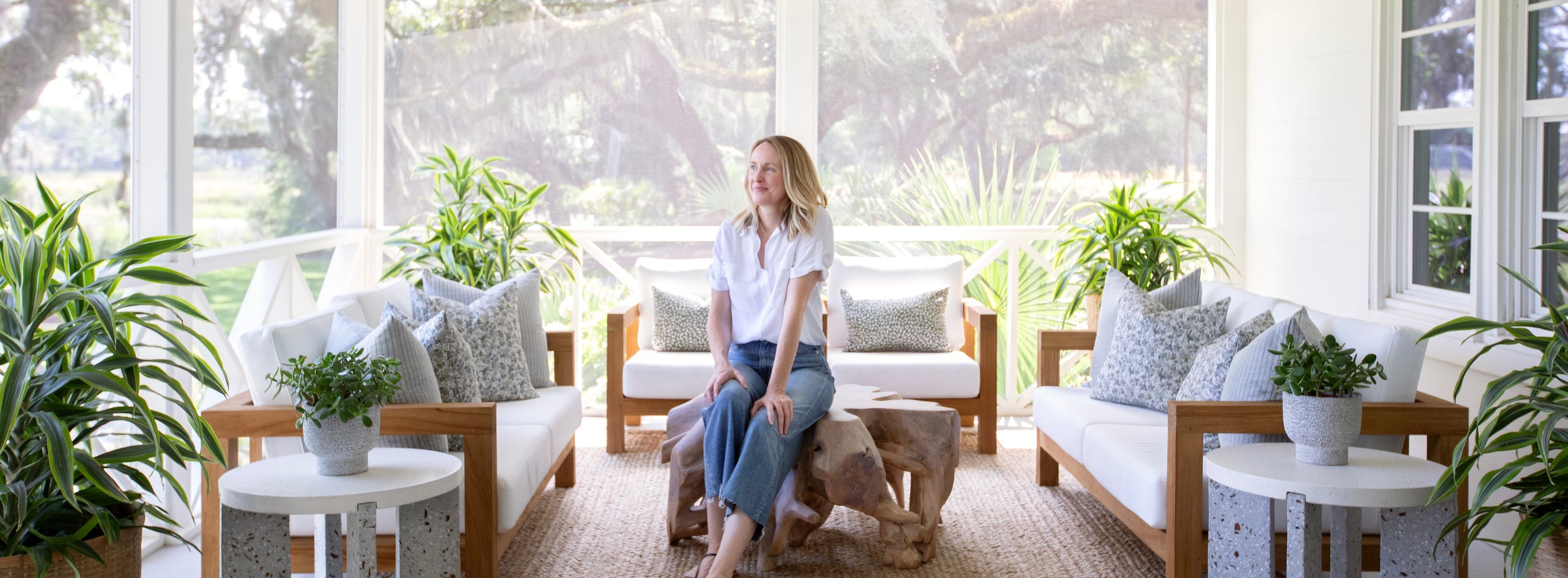 An image of Emily Daws on the porch of the Kiawah River Farmhouse