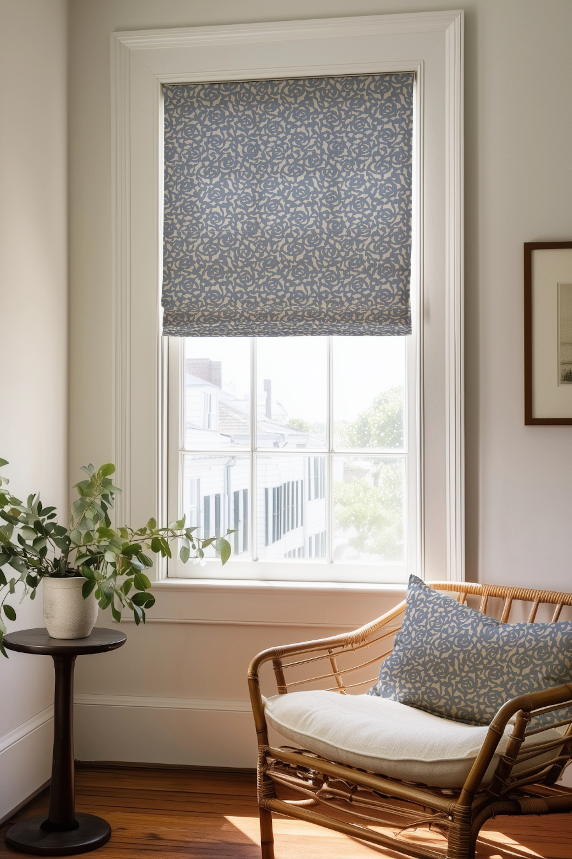 Corner of a bedroom in a Charleston home with a Roman shade and pillow in Gardenia fabric in Cobalt by Emily Daws.