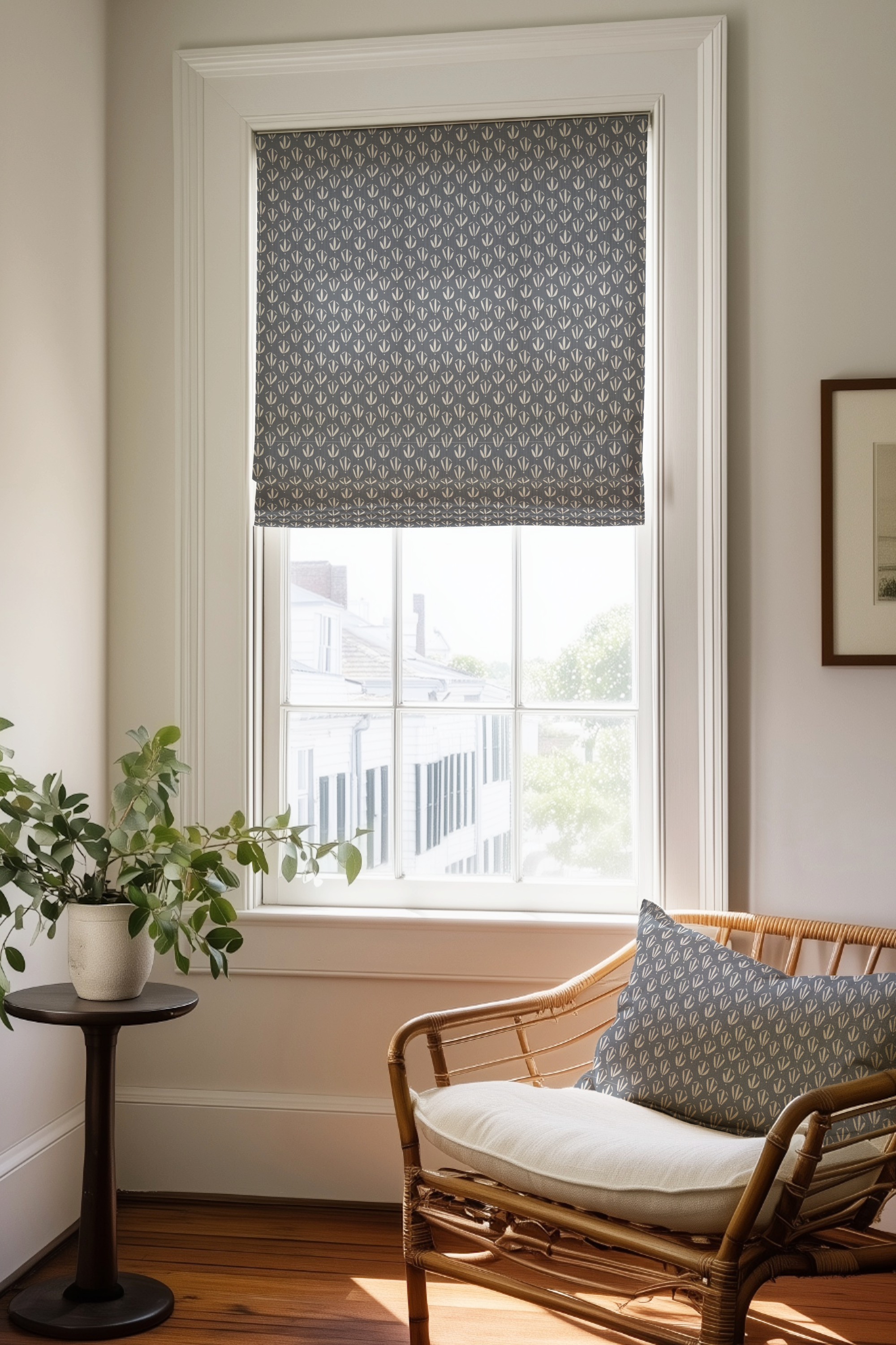 Corner of a bedroom in a Charleston home with a Roman shade and pillow in Kiawah fabric in Lake by Emily Daws.