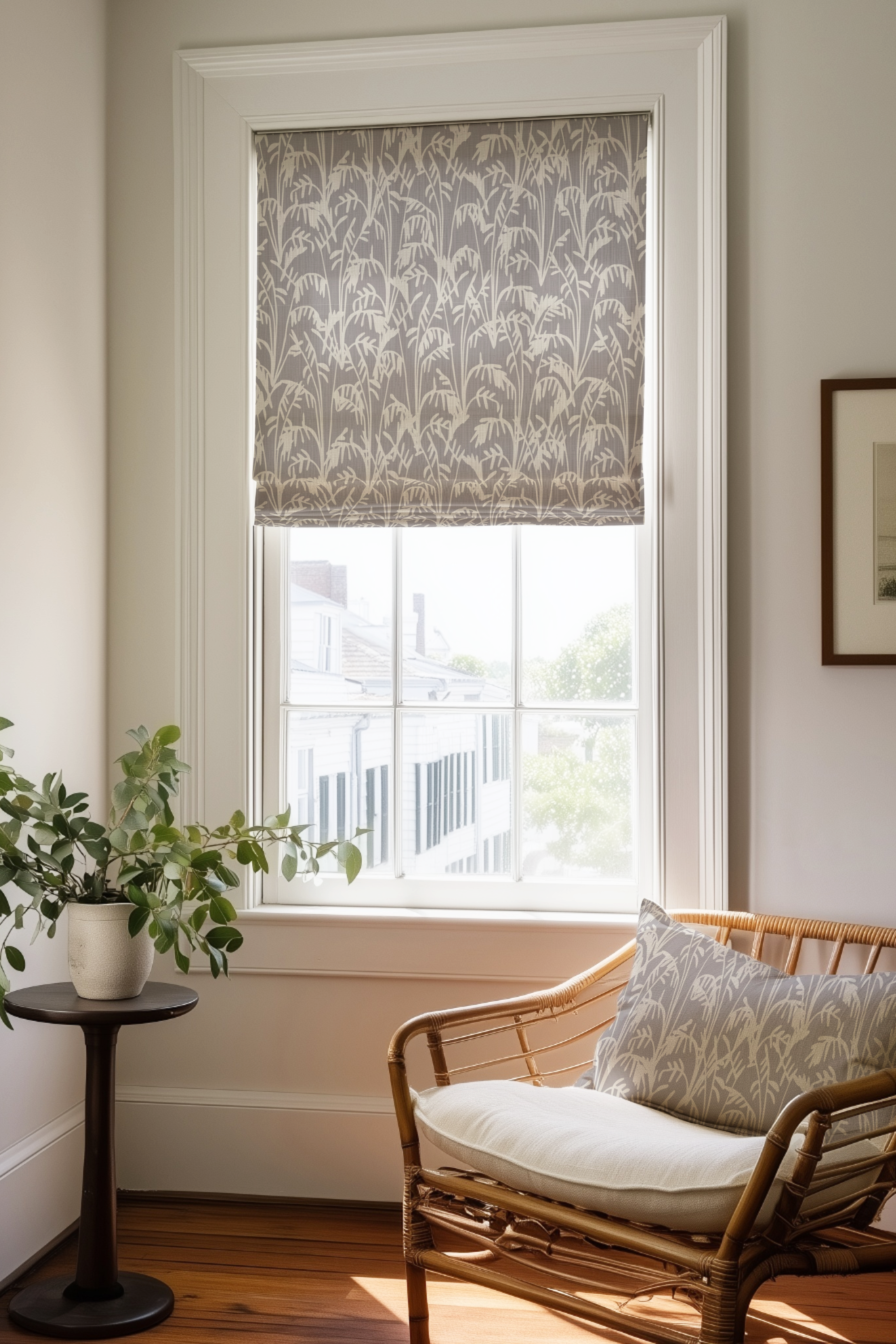 Corner of a bedroom in a Charleston home with a Roman shade and pillow in Seabrook fabric in Twilight by Emily Daws.