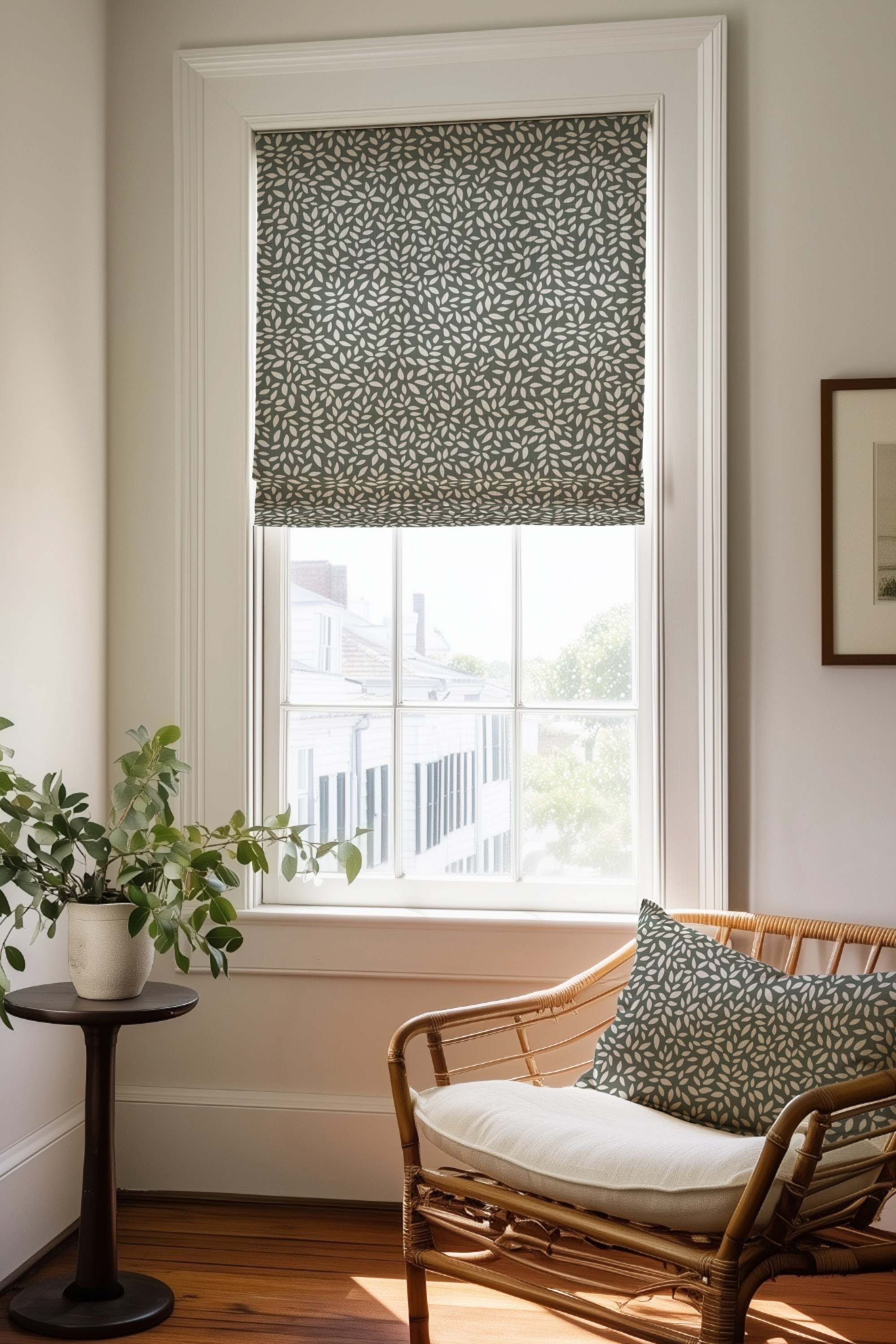 Corner of a bedroom in a Charleston home with a Roman shade and pillow in Wadmalaw fabric in Forest by Emily Daws.