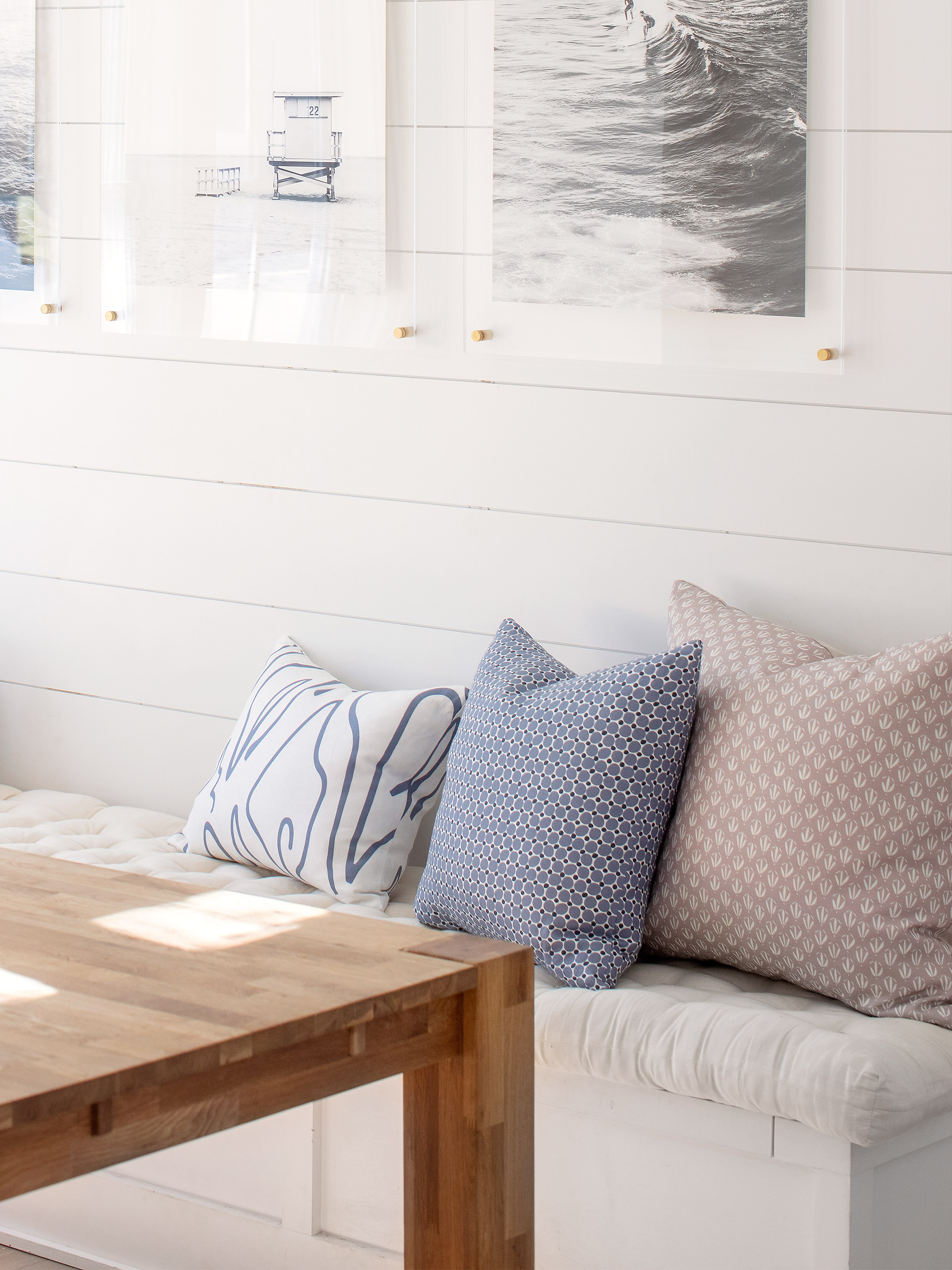 Cobblestone pillow in Ink styled by Emily Daws – placed on a vintage settee in a Charleston cottage