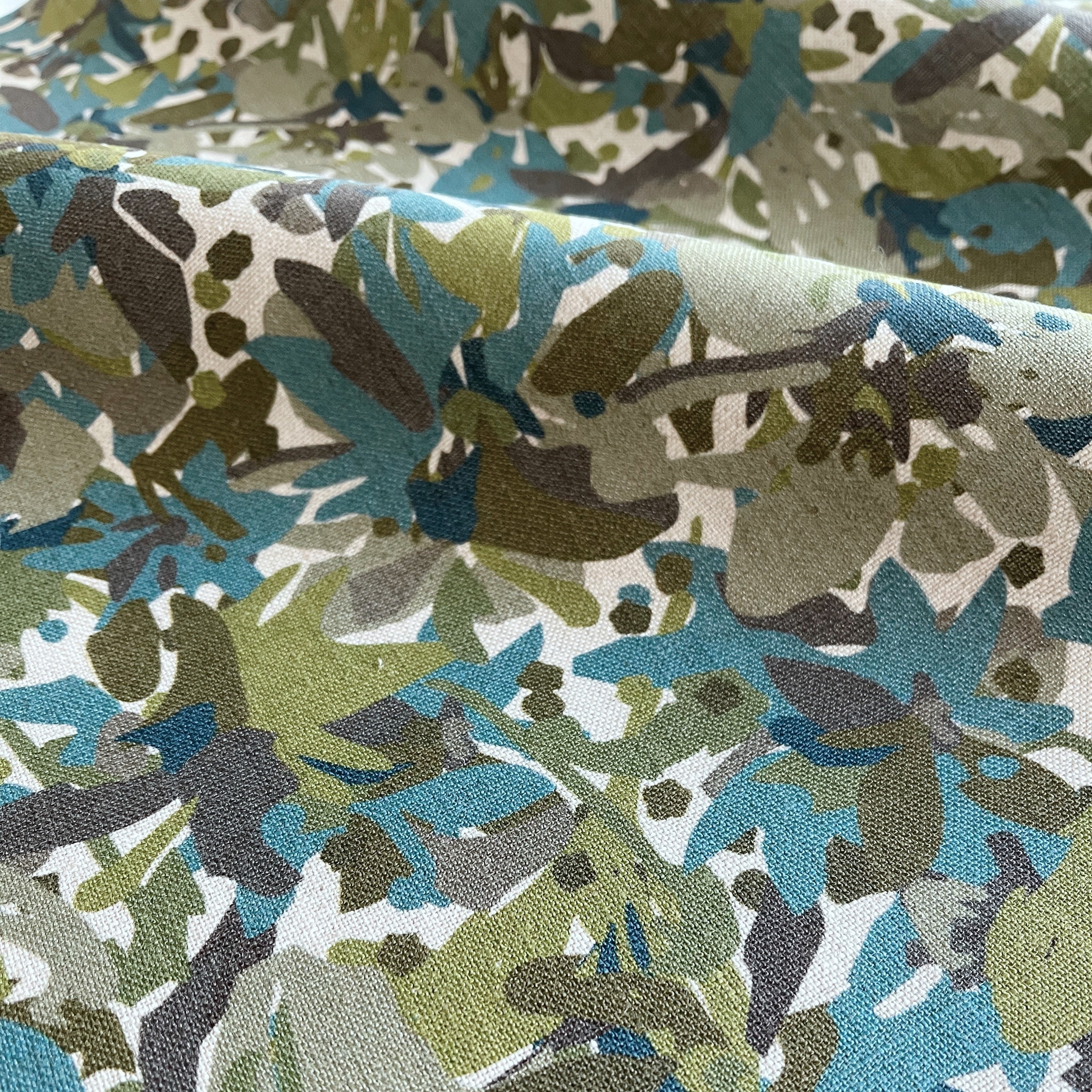 Thicket fabric in Emerald – close-up of linen texture and leafy pattern; perfect for pattern sofas