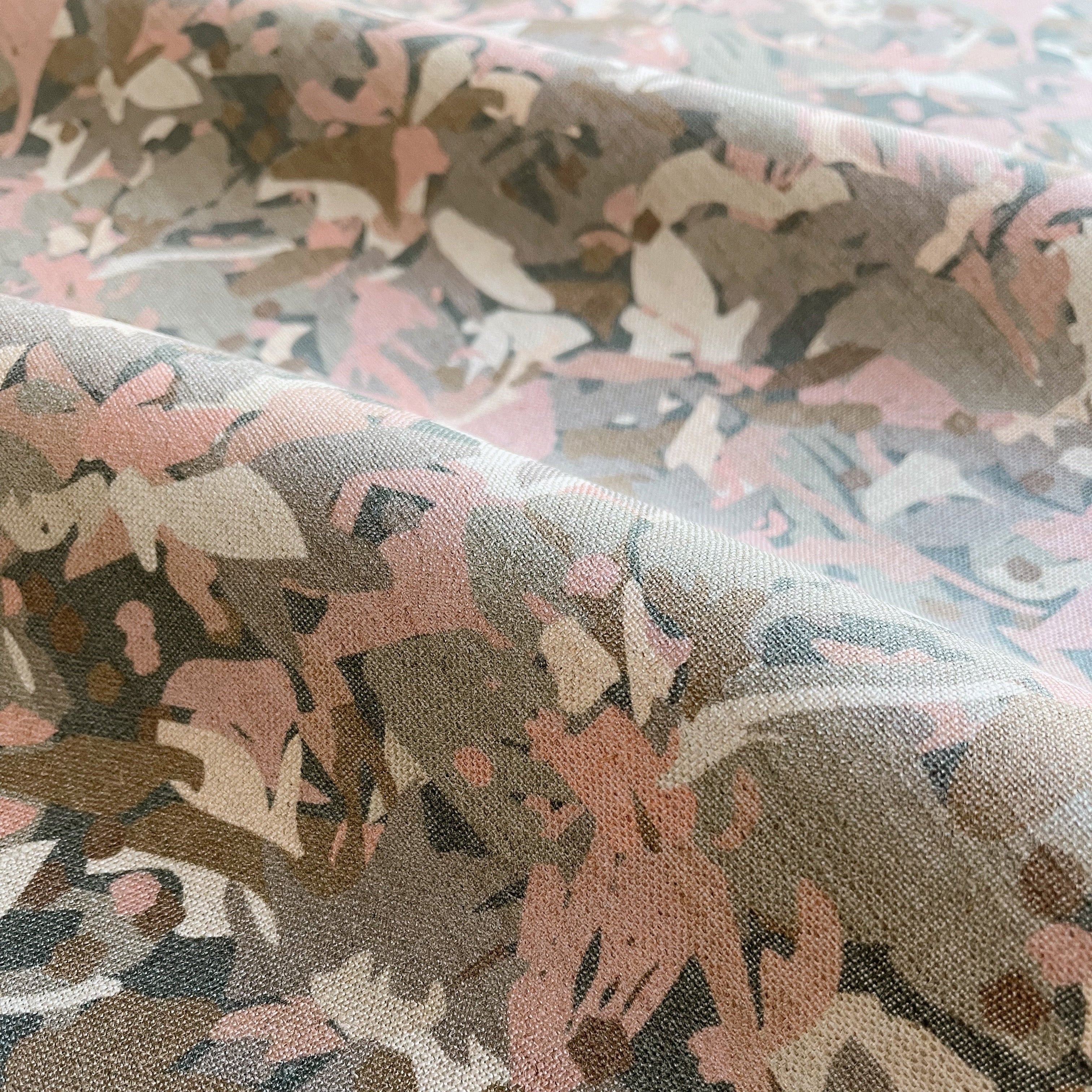 Thicket fabric in Rouge – close-up of linen texture and leafy pattern; perfect for pattern sofas